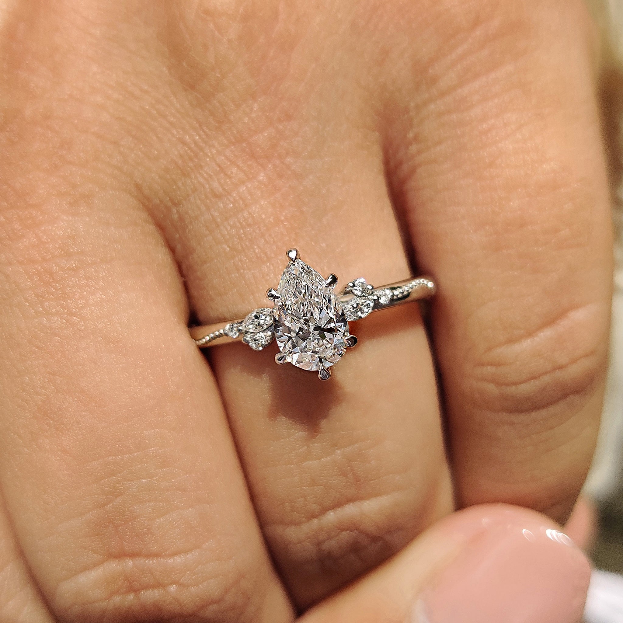 Carat diamonds engagement ring with pear diamond style.
