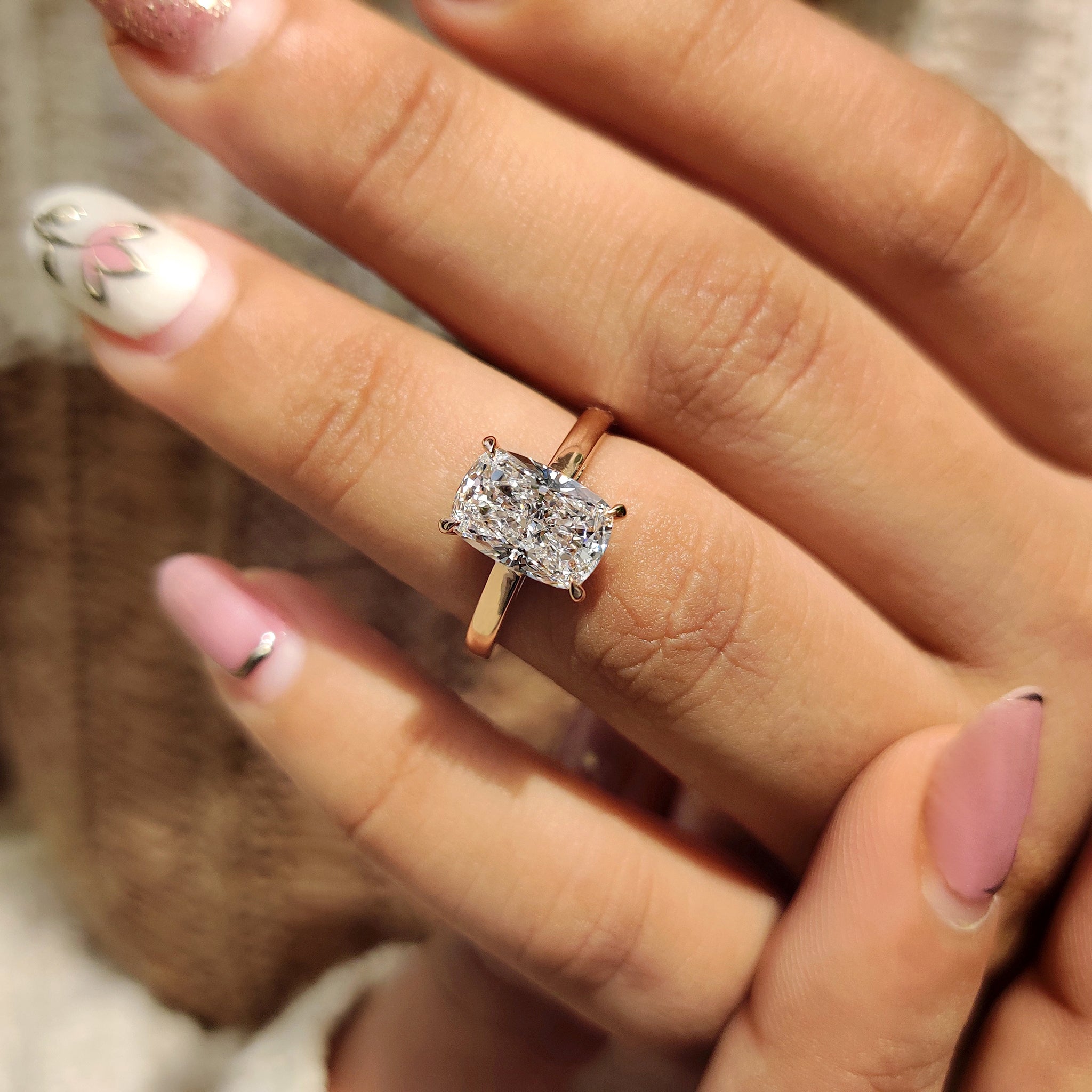 4 claw prong setting with rose gold engagement ring.
