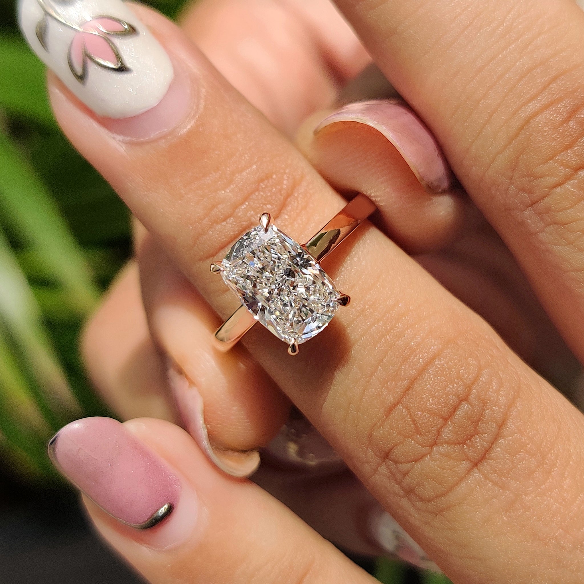 Cushion cut diamond engagement ring with handmade jewelry.
