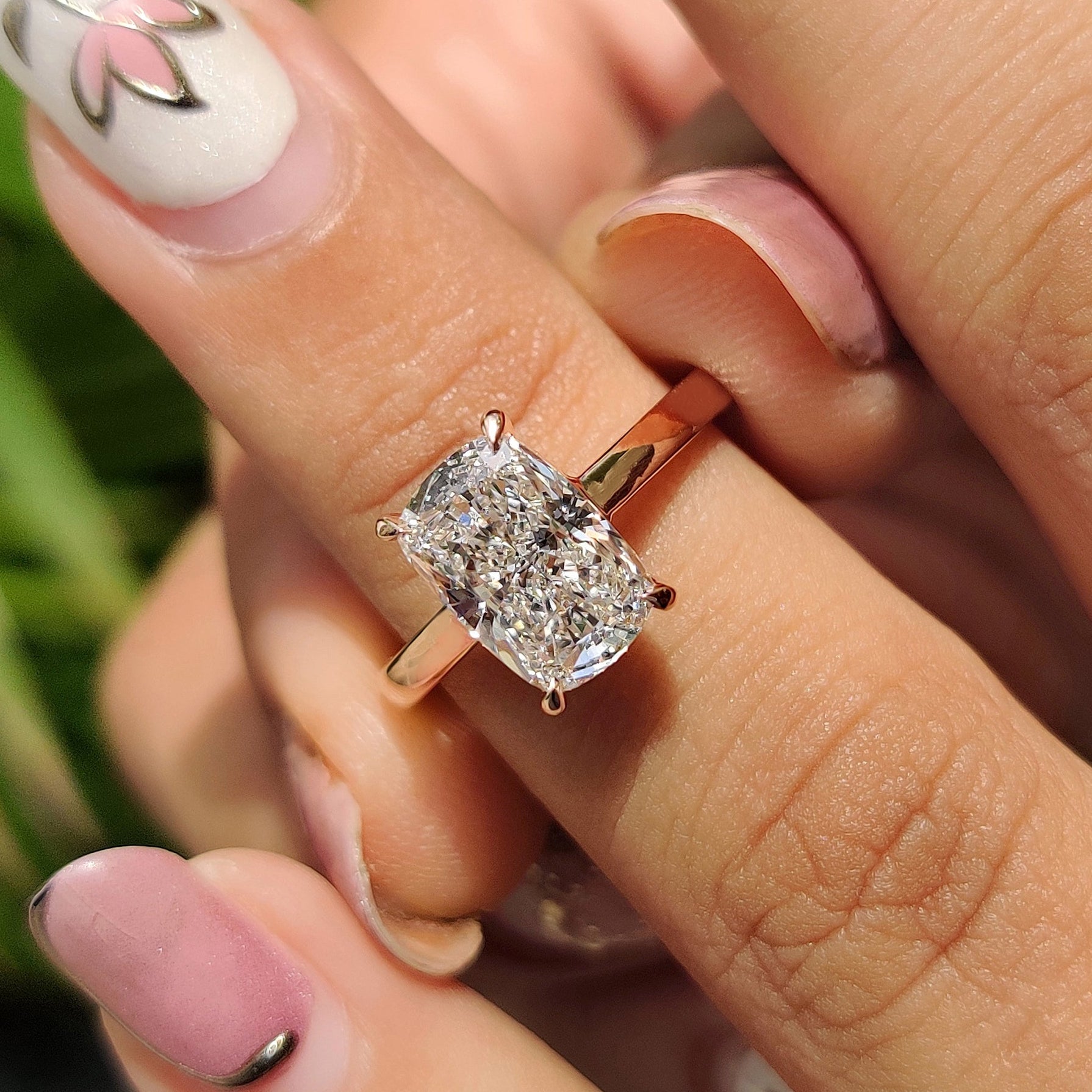 Cushion cut diamond engagement ring with solitaire diamond ring.
