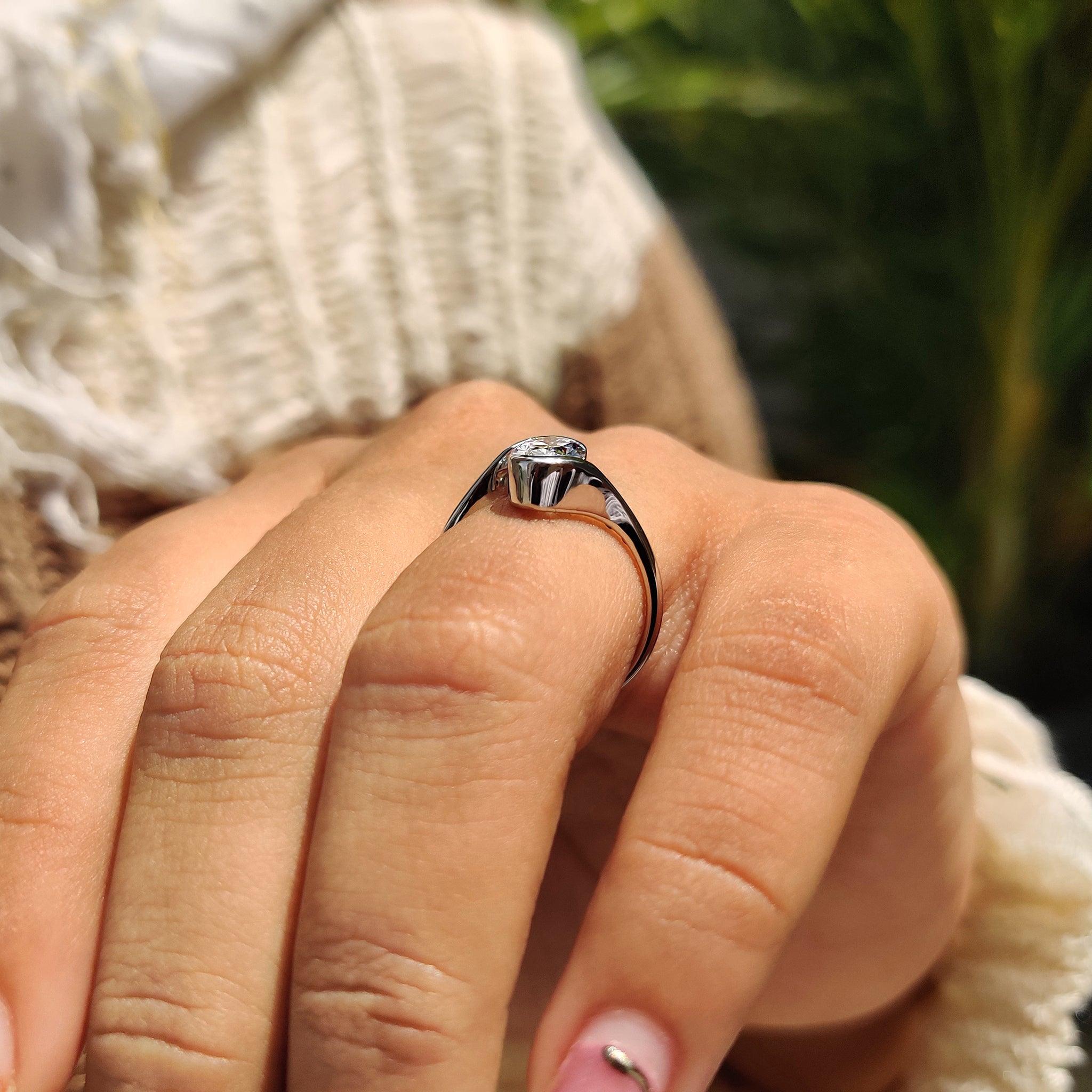 Handmade ring with white gold and oval diamond center stone.
