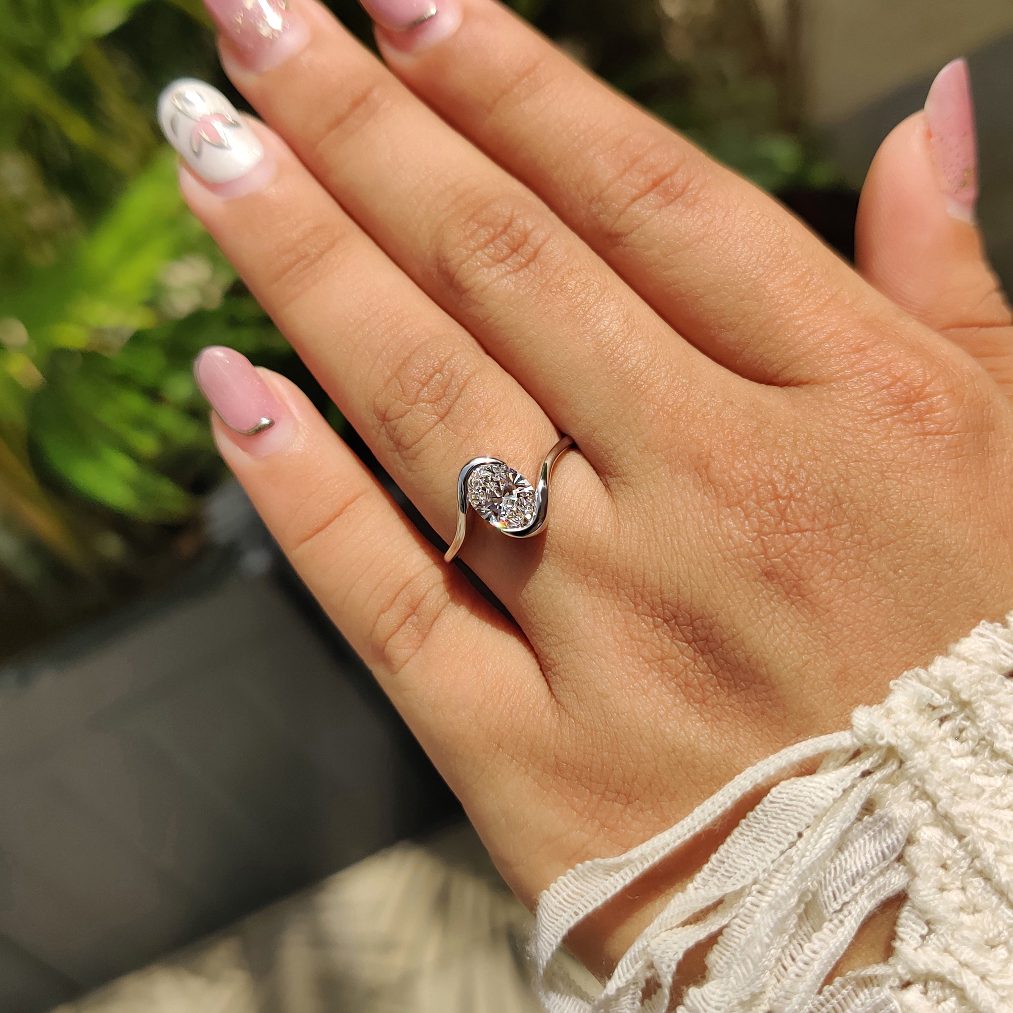 IGI certified lab grown diamond in a unique oval engagement ring.

