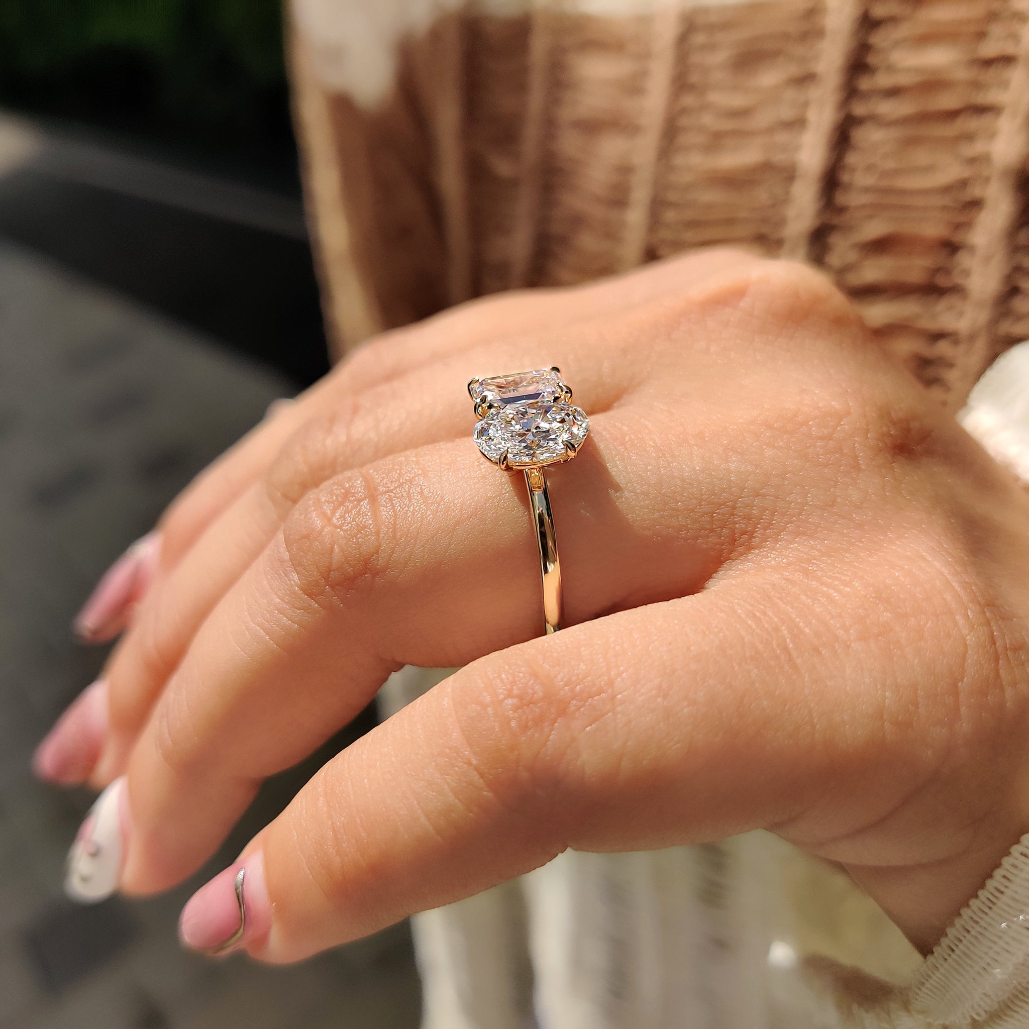 Oval engagement ring with emerald cut diamond ring.

