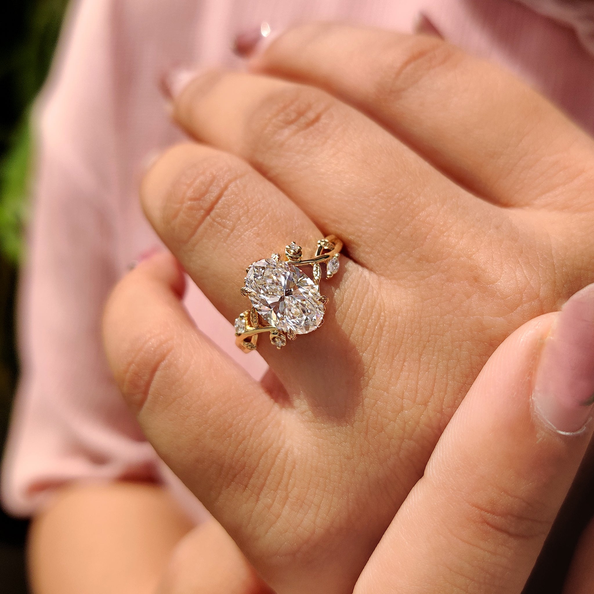 Marquise and round side stone with 4 leaf style prong setting.
