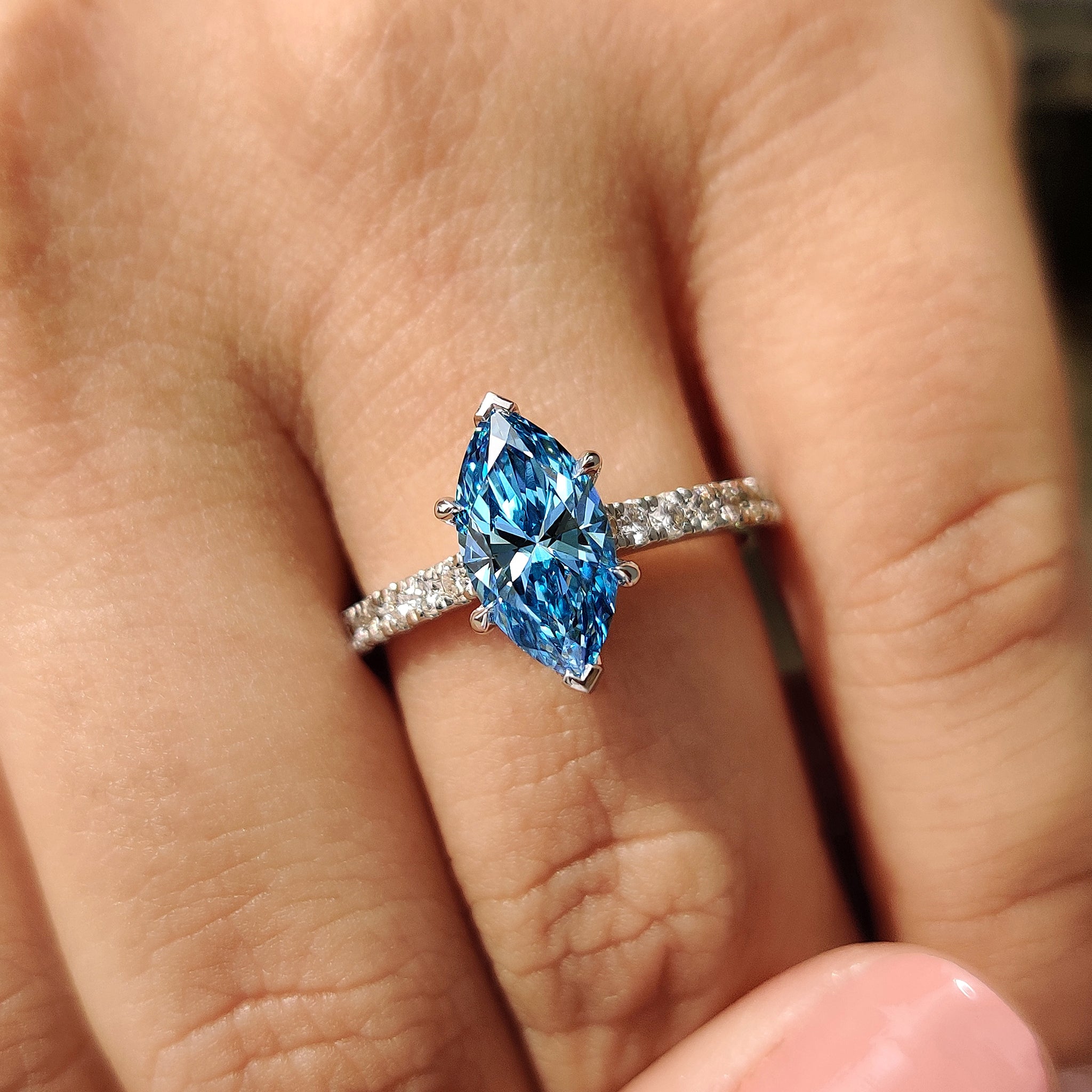 White gold engagement ring with 4 claw prong setting.