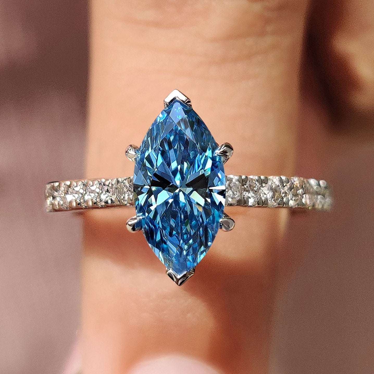 V prong setting with pave setting band.