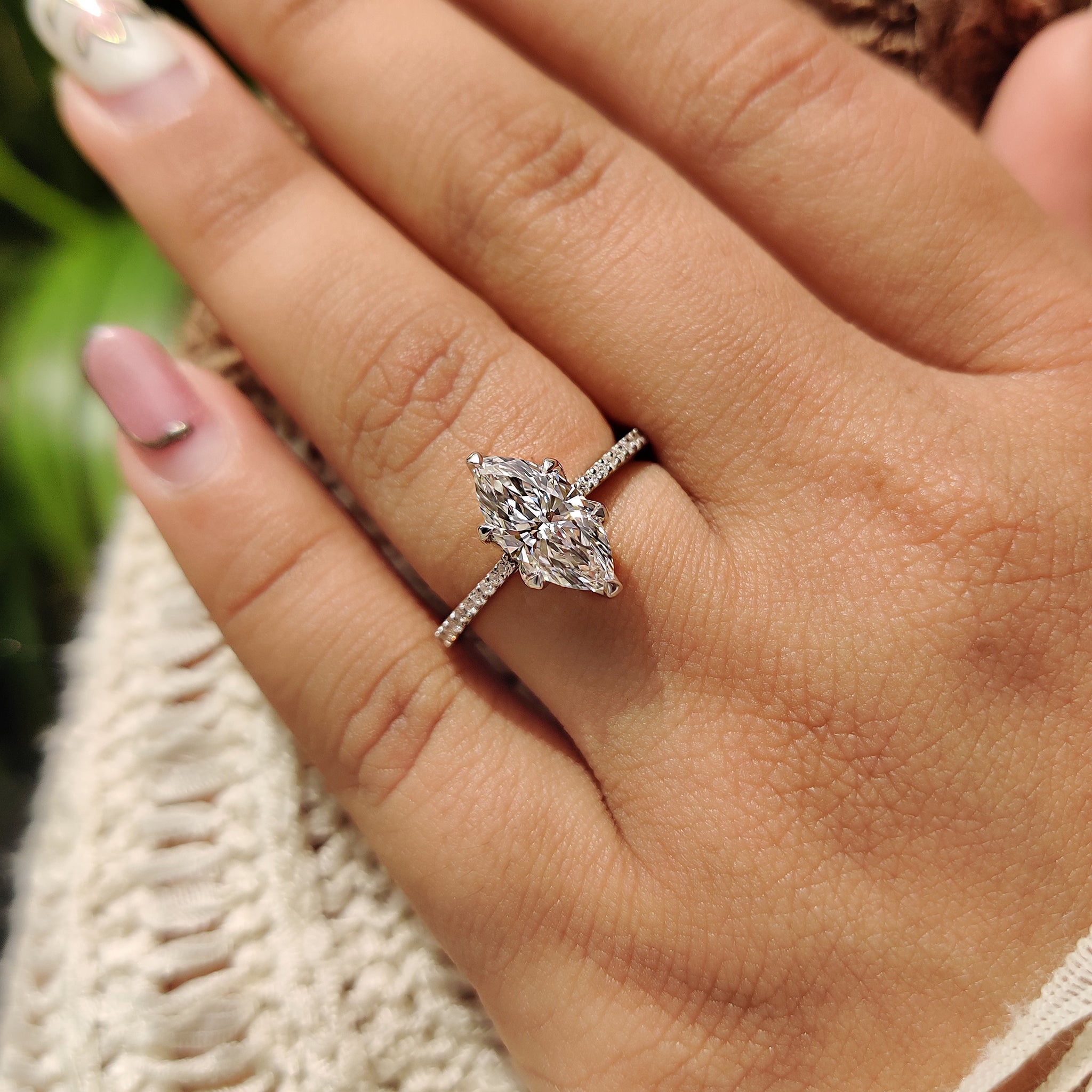 Six claw prong setting with round cut pave setting.
