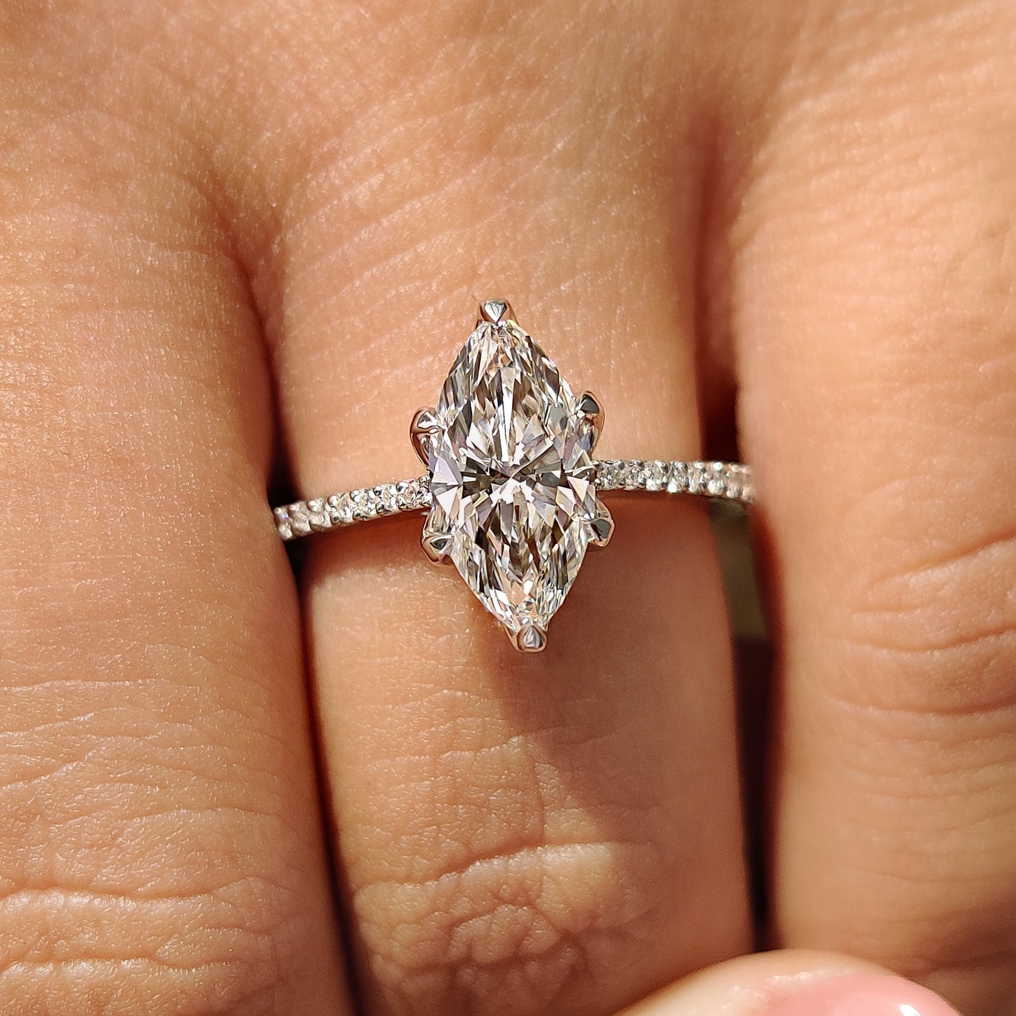 Carat diamonds ring with round cut pave setting.