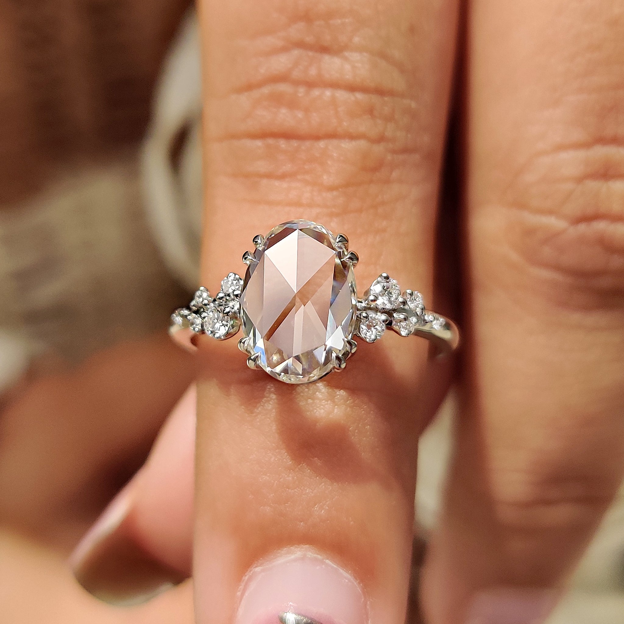 Cluster diamond ring with double claw prong setting.