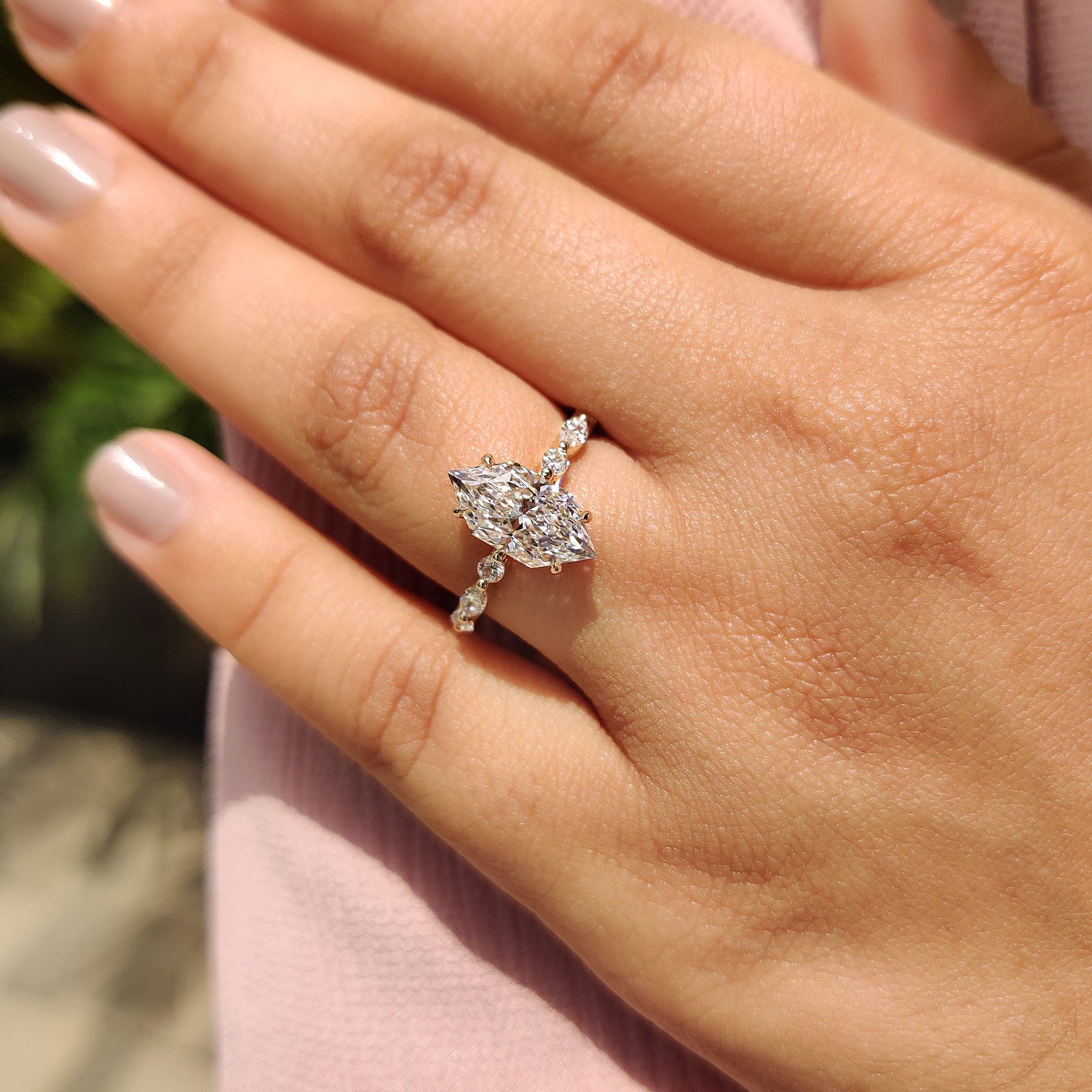 4 claw prong setting with yellow gold engagement ring.