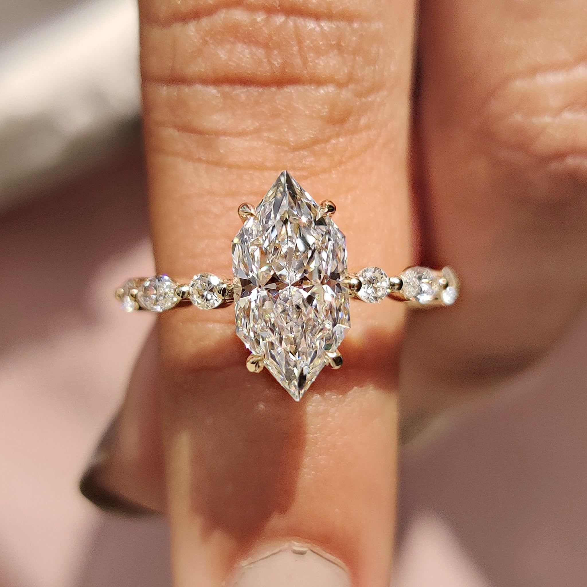 Floating bubble prong with yellow gold engagement ring.