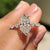 Dutch marquise engagement ring with marquise and round pave set.