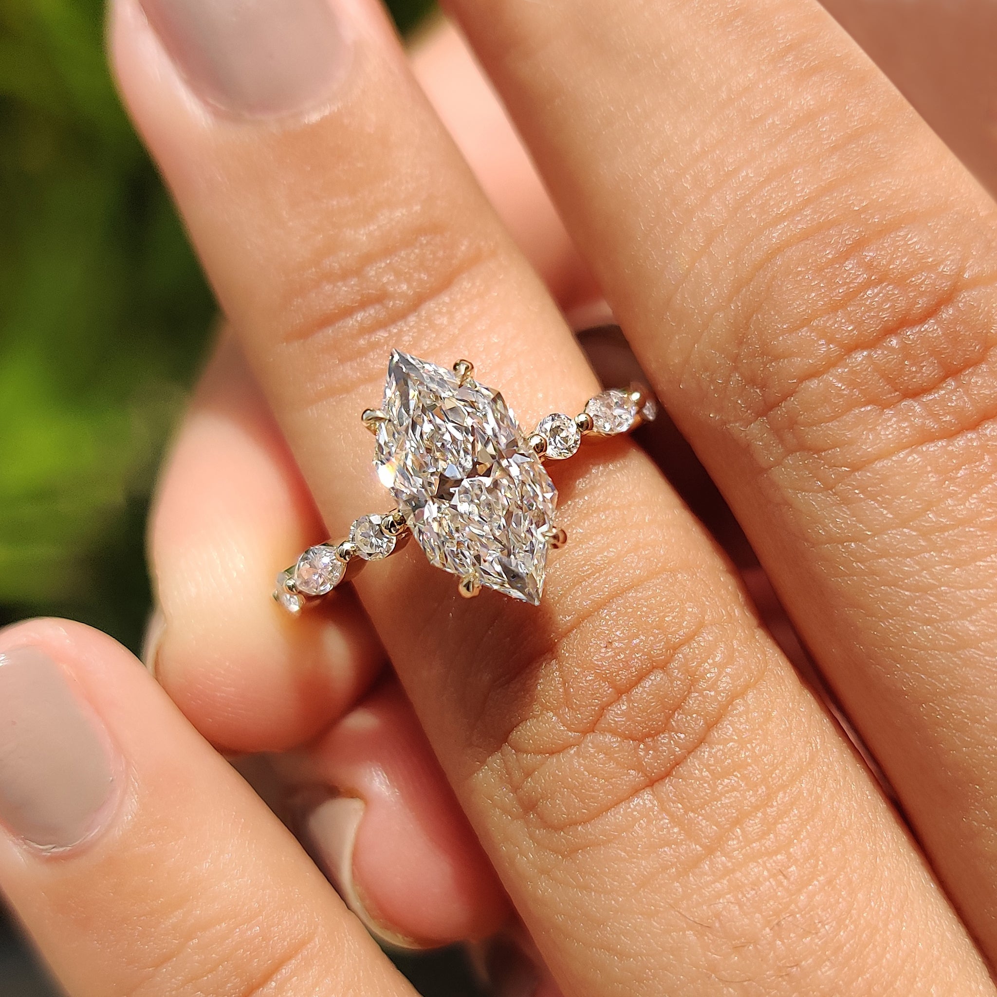 Marquise and round pave set with floating bubble prong.