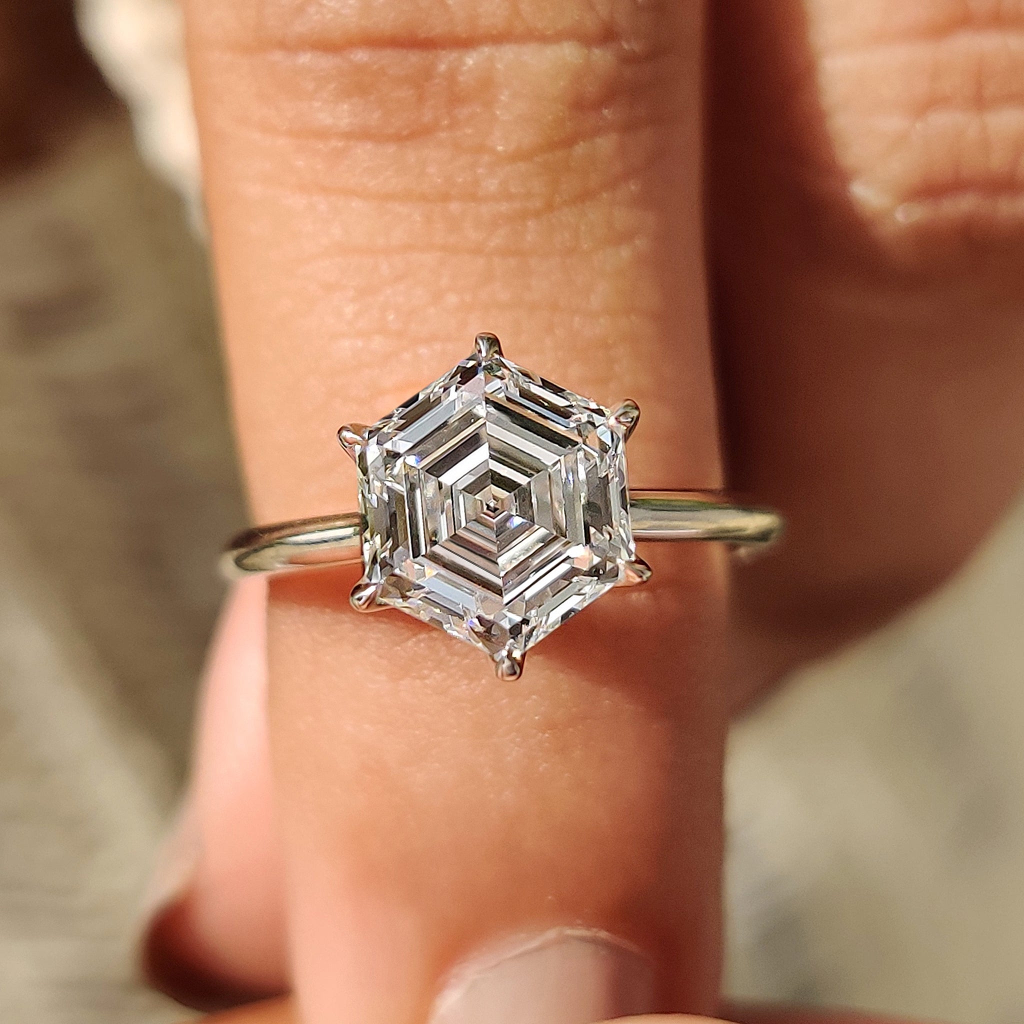 Solitaire diamond engagement ring with hexagon engagement ring.