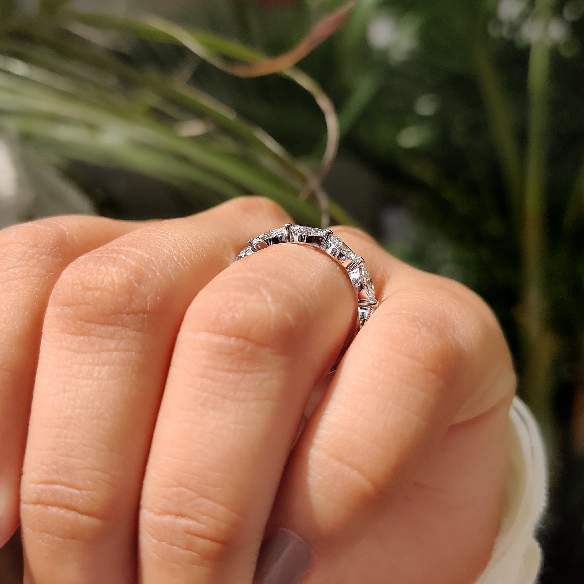 Shared prong wedding band with marquise cut stones.