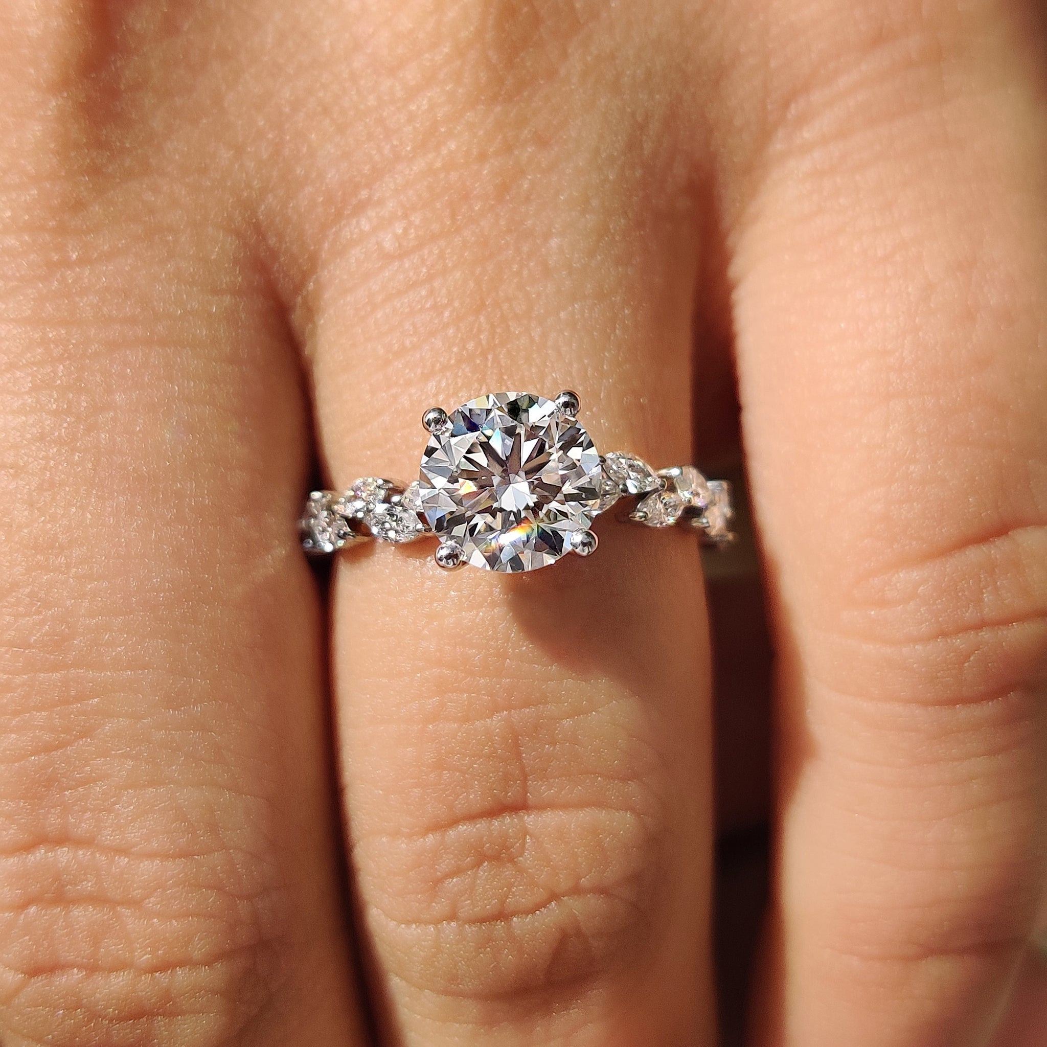 Round cut engagement ring with 4 prong setting.