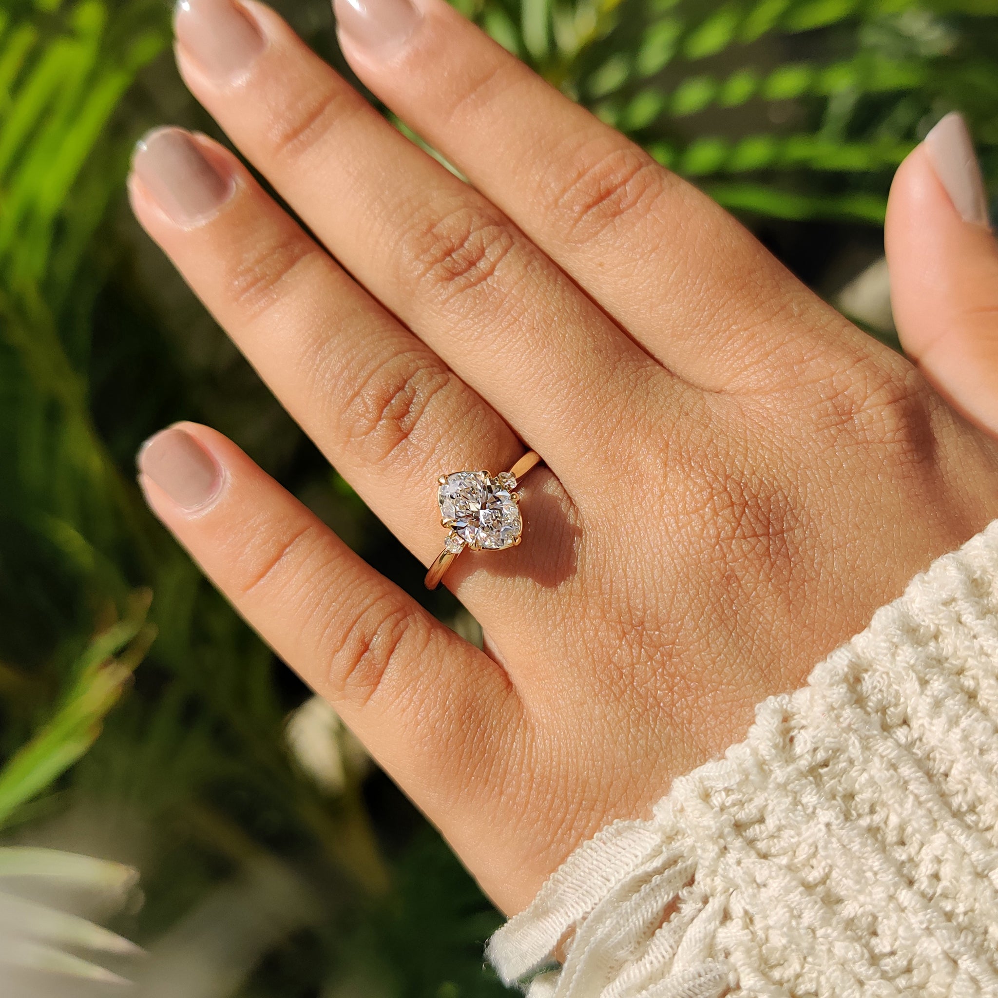 3 stone engagement ring with tulip basket setting.