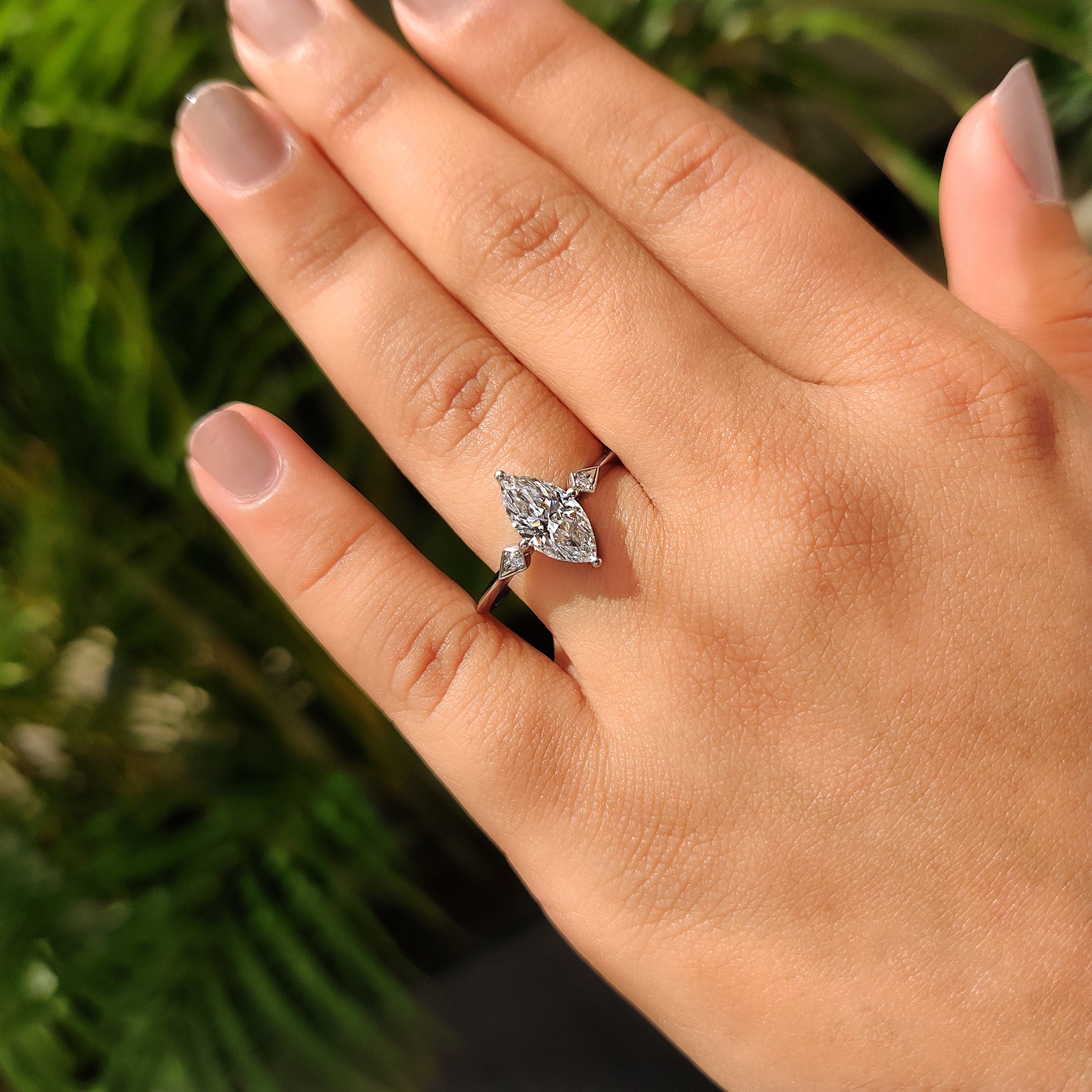 Compass prong setting with knife edge shank ring.