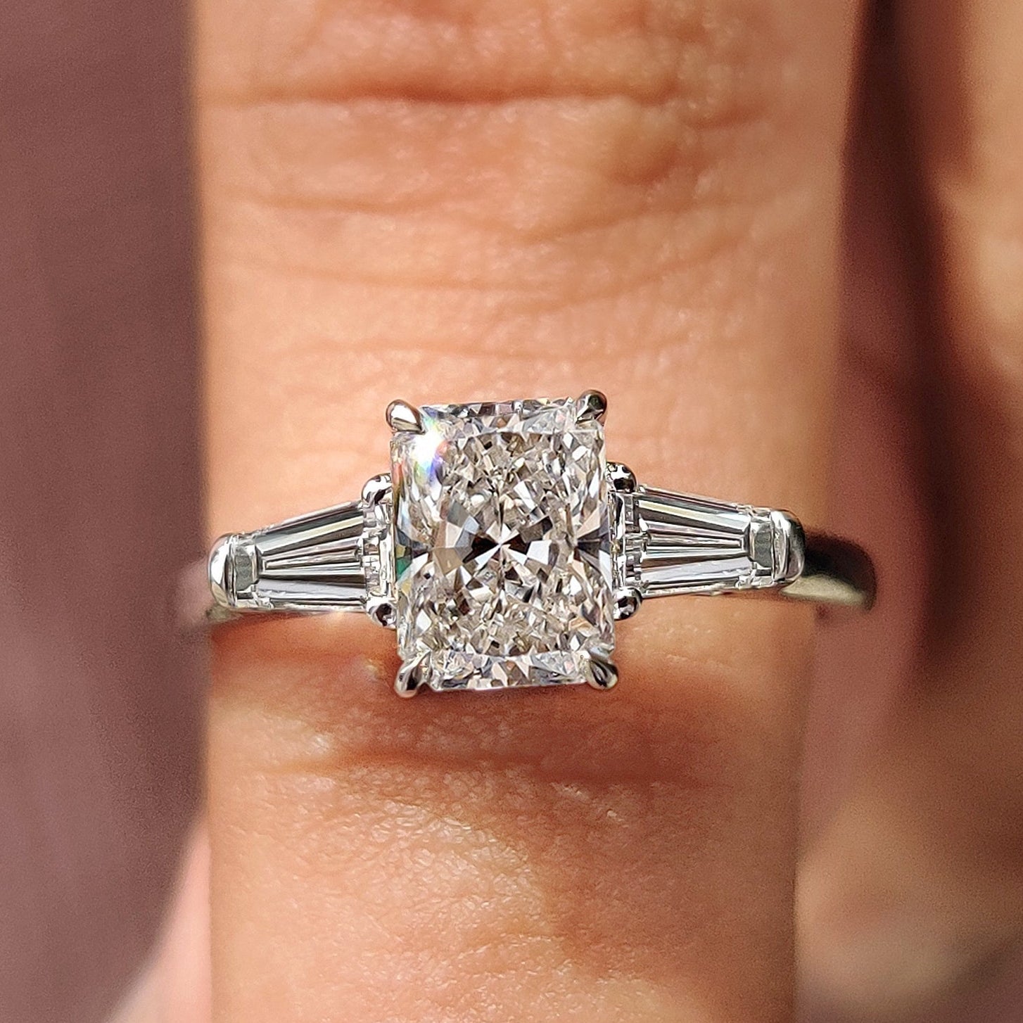 3 stone diamond engagement ring with radiant cut diamond ring.

