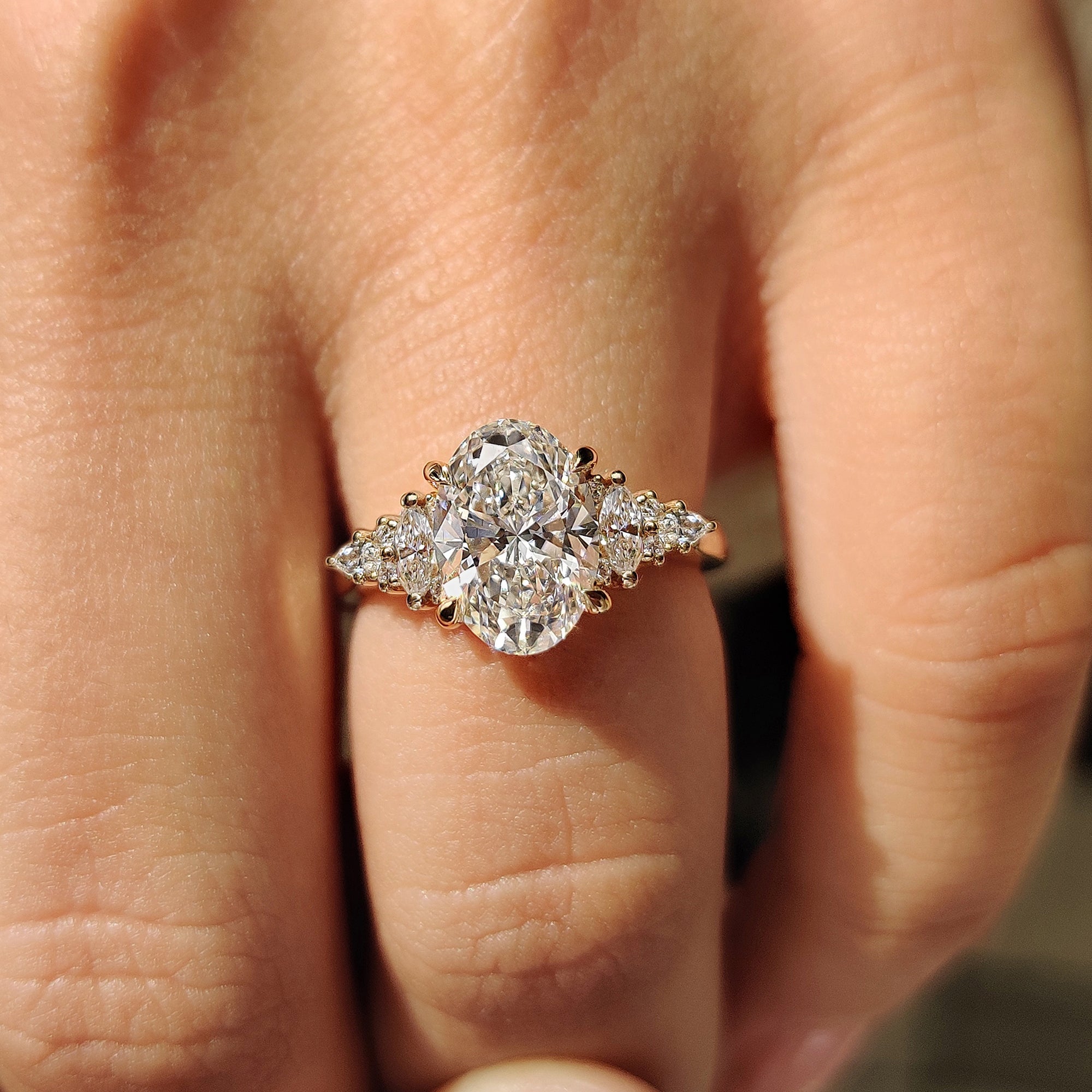 Cathedral setting engagement ring with oval cut engagement ring.