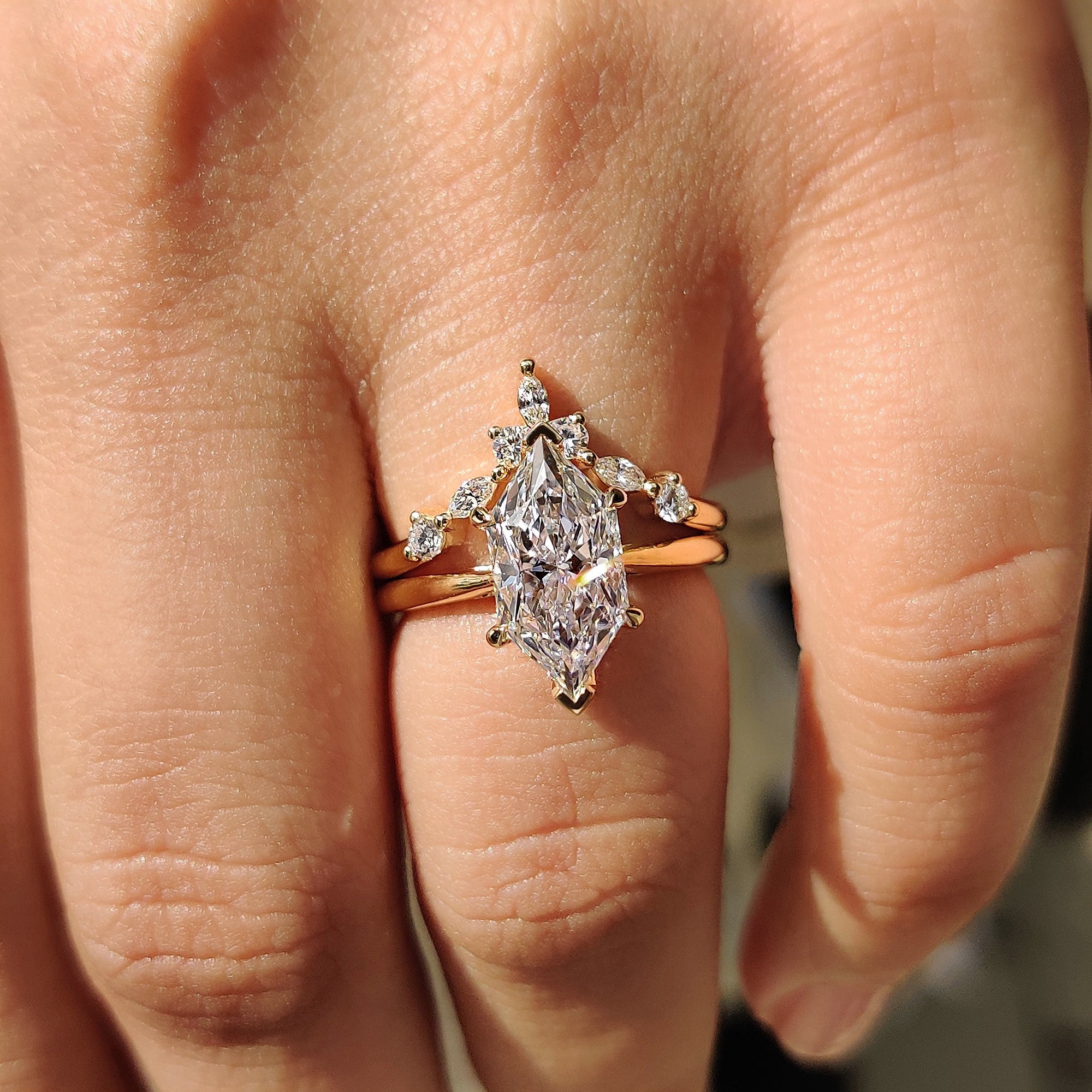 Tapered shank ring in cathedral setting ring.