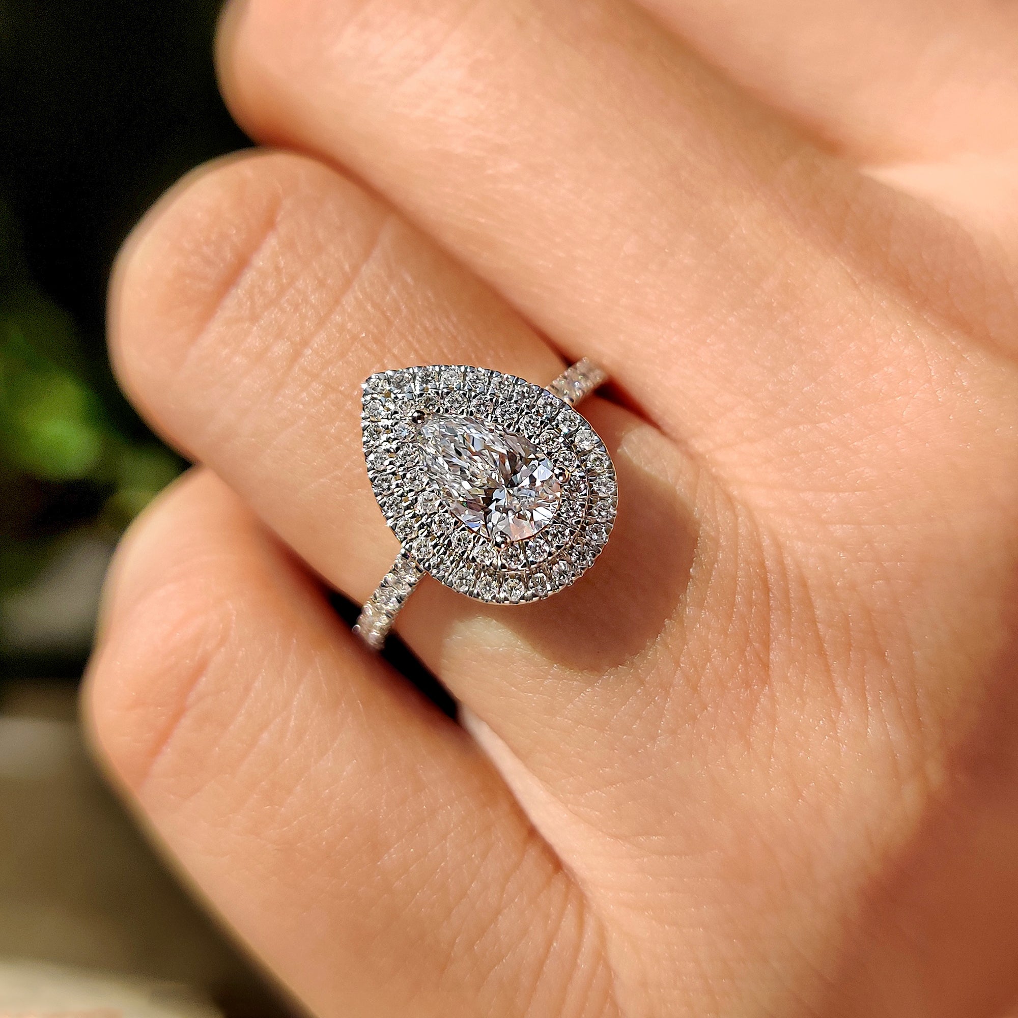 Pave setting engagement ring with teardrop shaped diamond ring.
