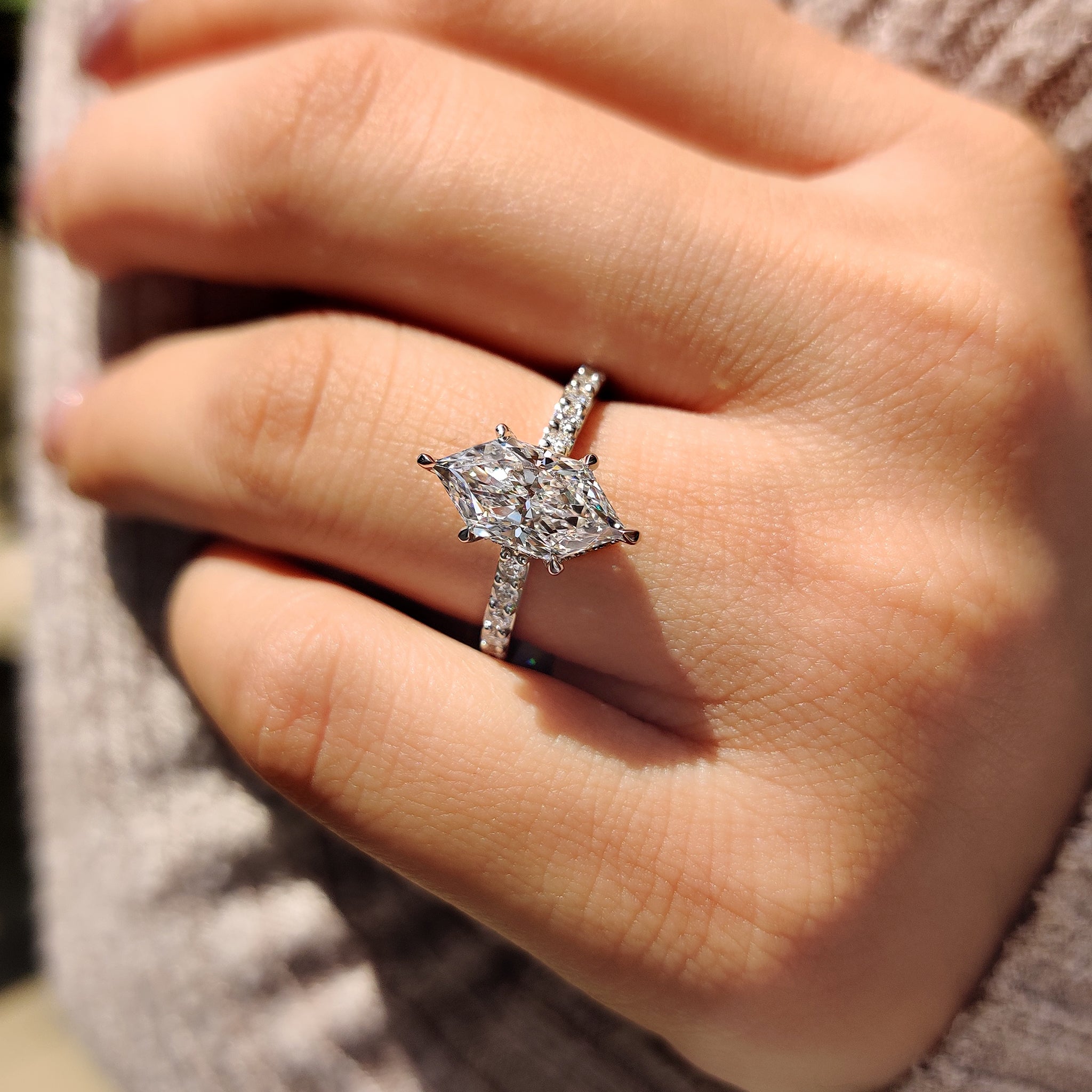 Cathedral setting engagement ring in pave setting ring.
