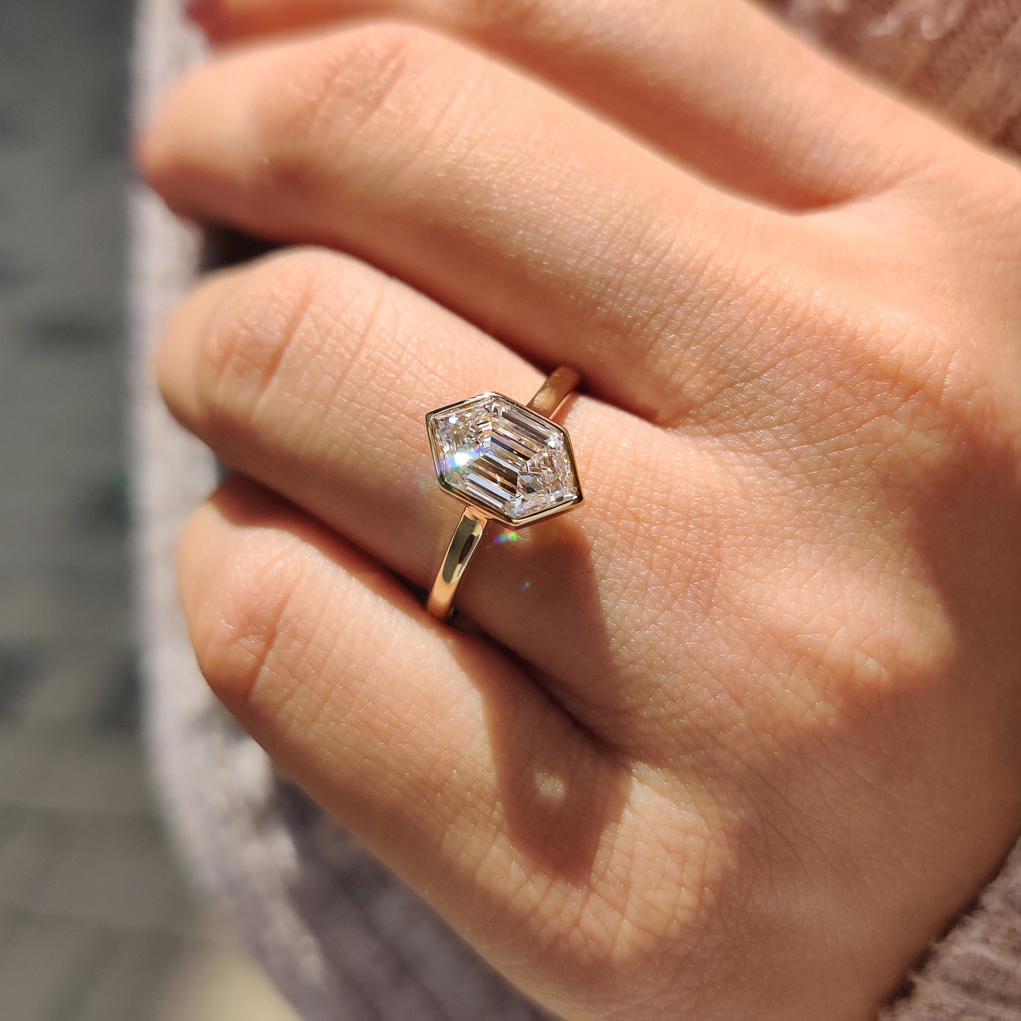 Unique engagement ring in cathedral setting ring.
