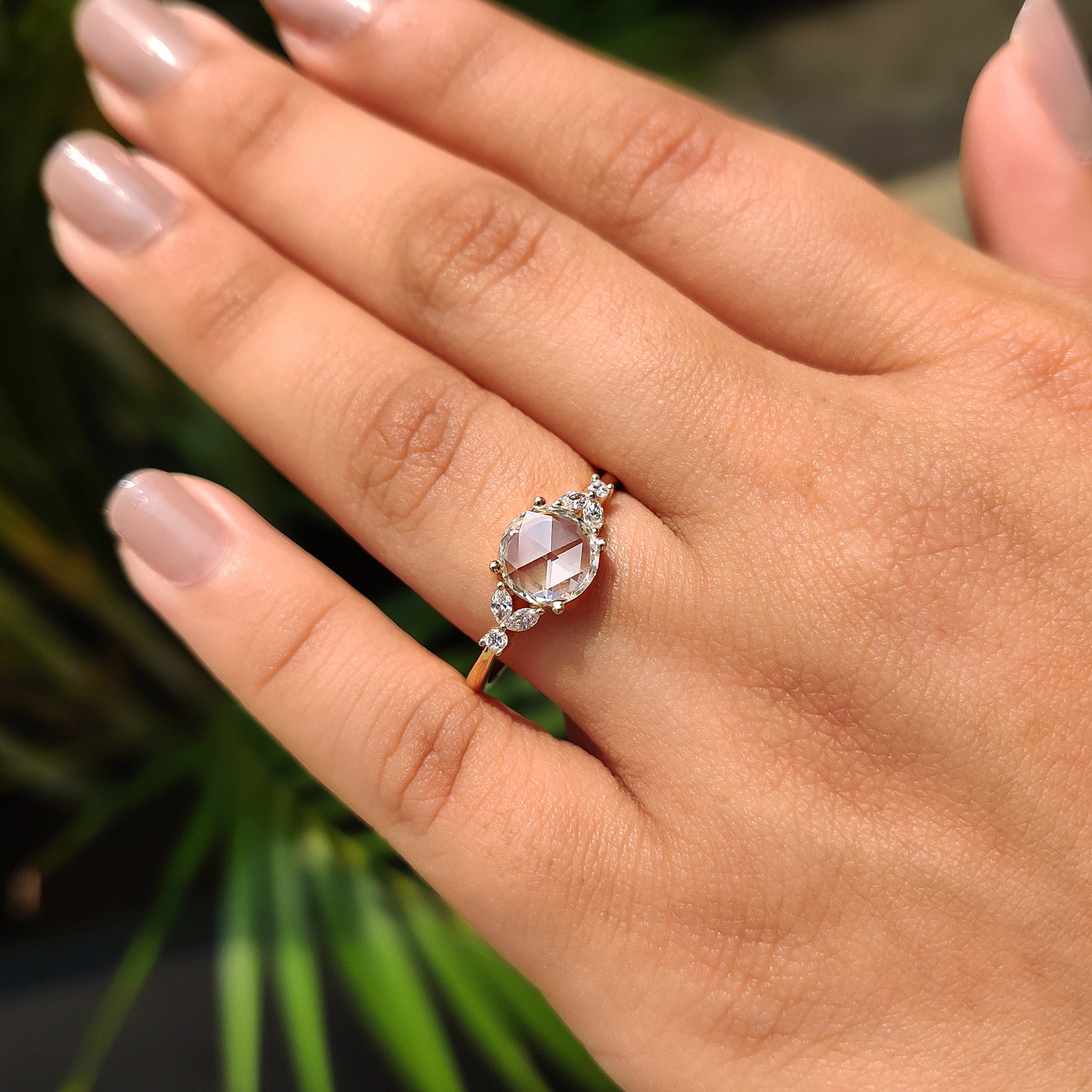 Seven stone diamond ring in yellow gold engagement ring.
