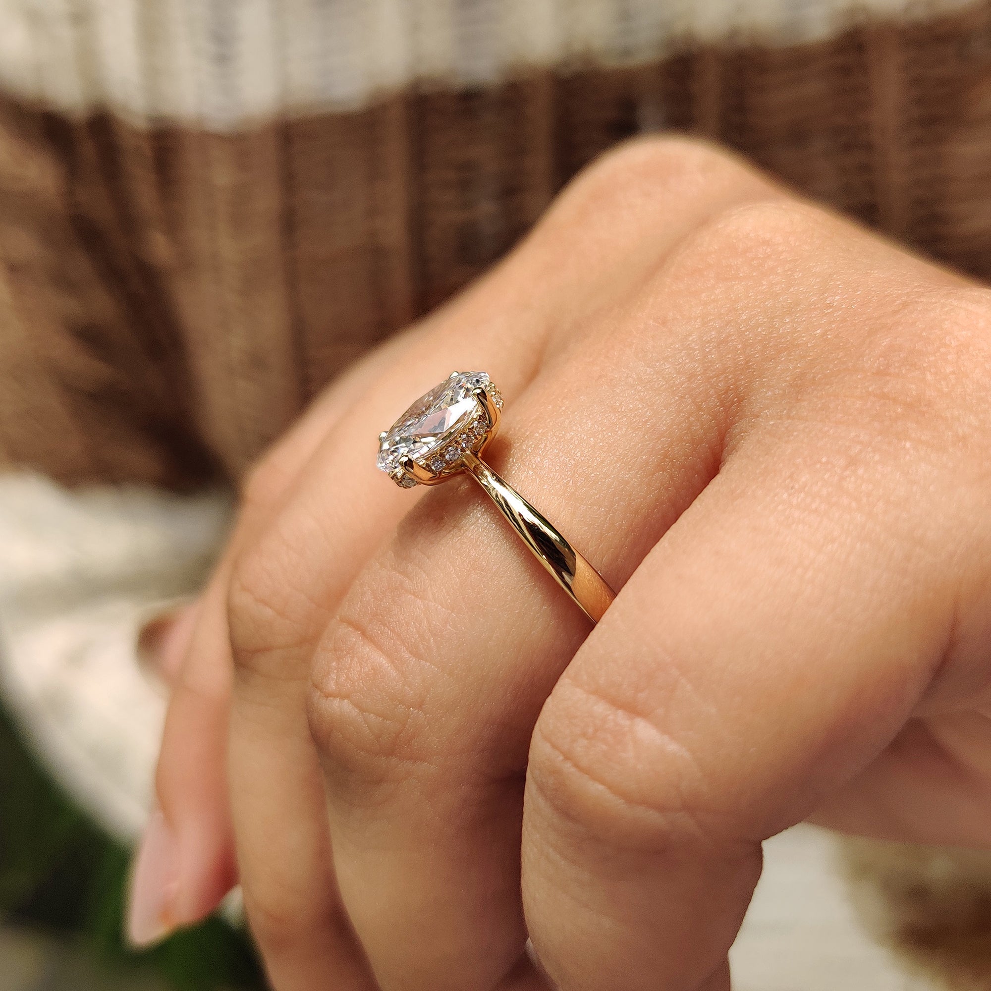 Oval cut engagement ring with hidden halo diamond ring.
