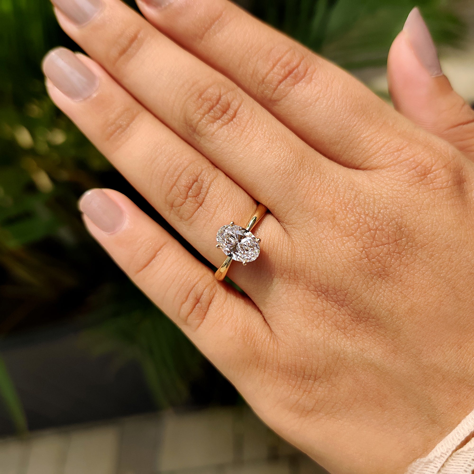 Hidden halo diamond ring with yellow gold engagement ring.
