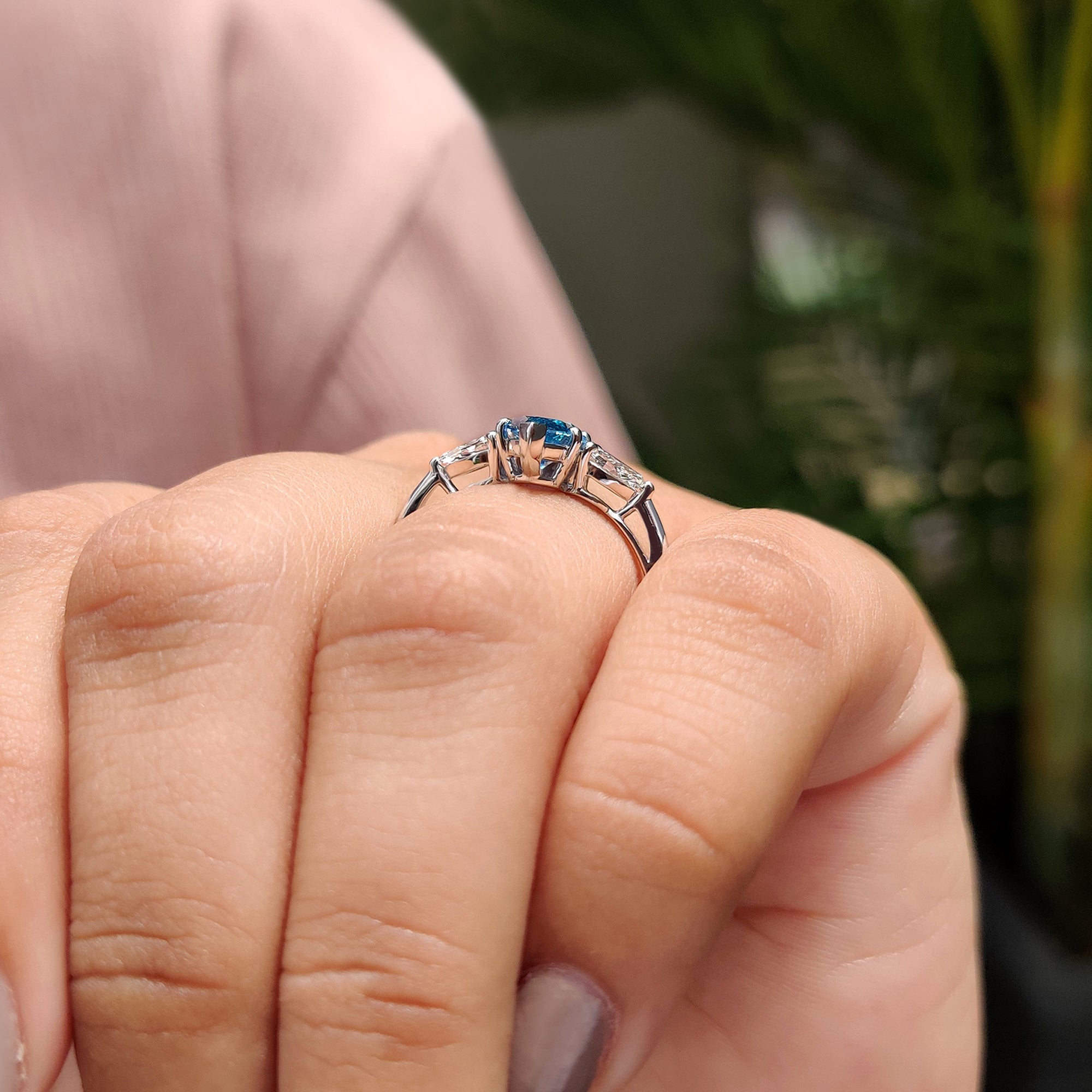 3 stone engagement ring with pear side stone.
