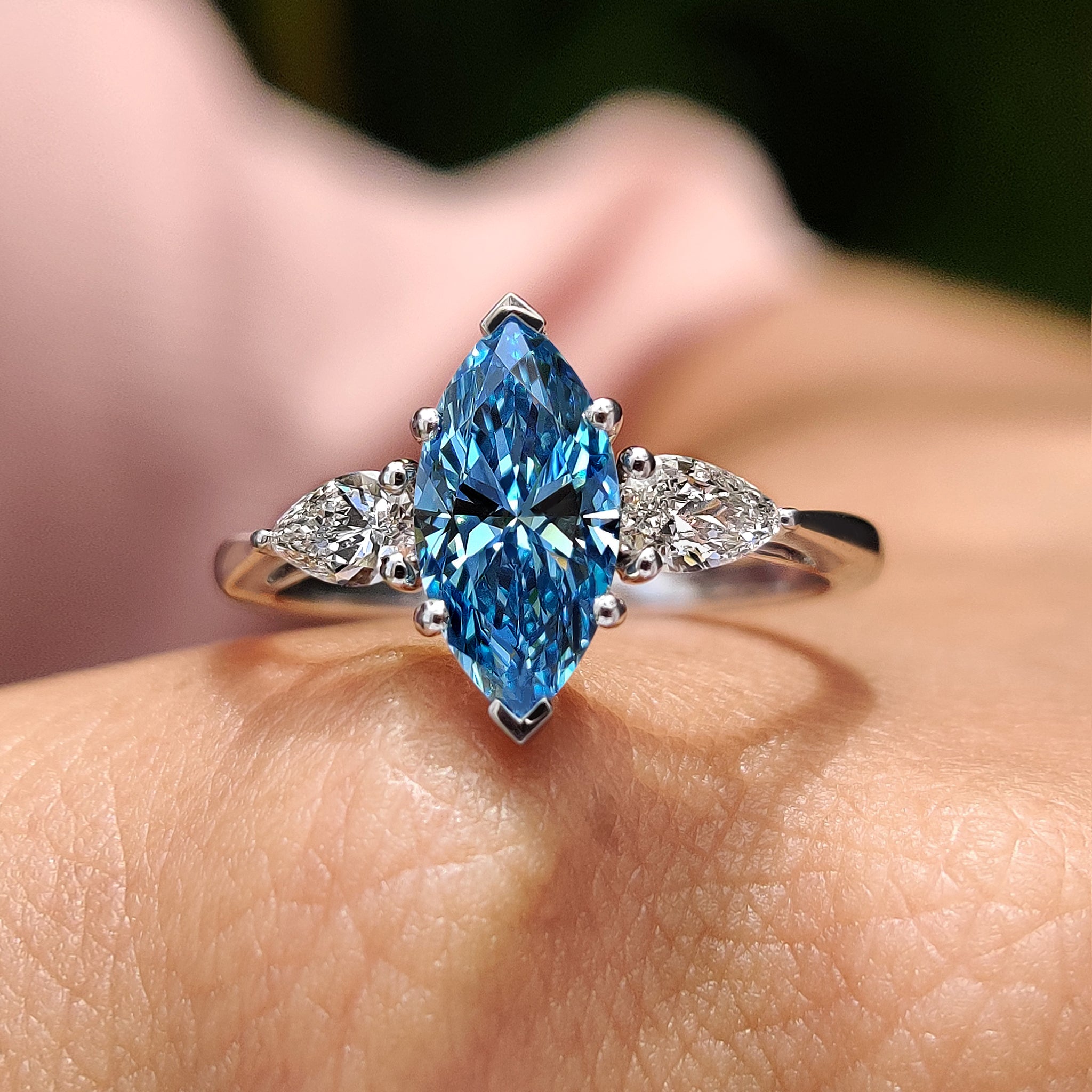 3 stone engagement ring in cathedral setting ring.