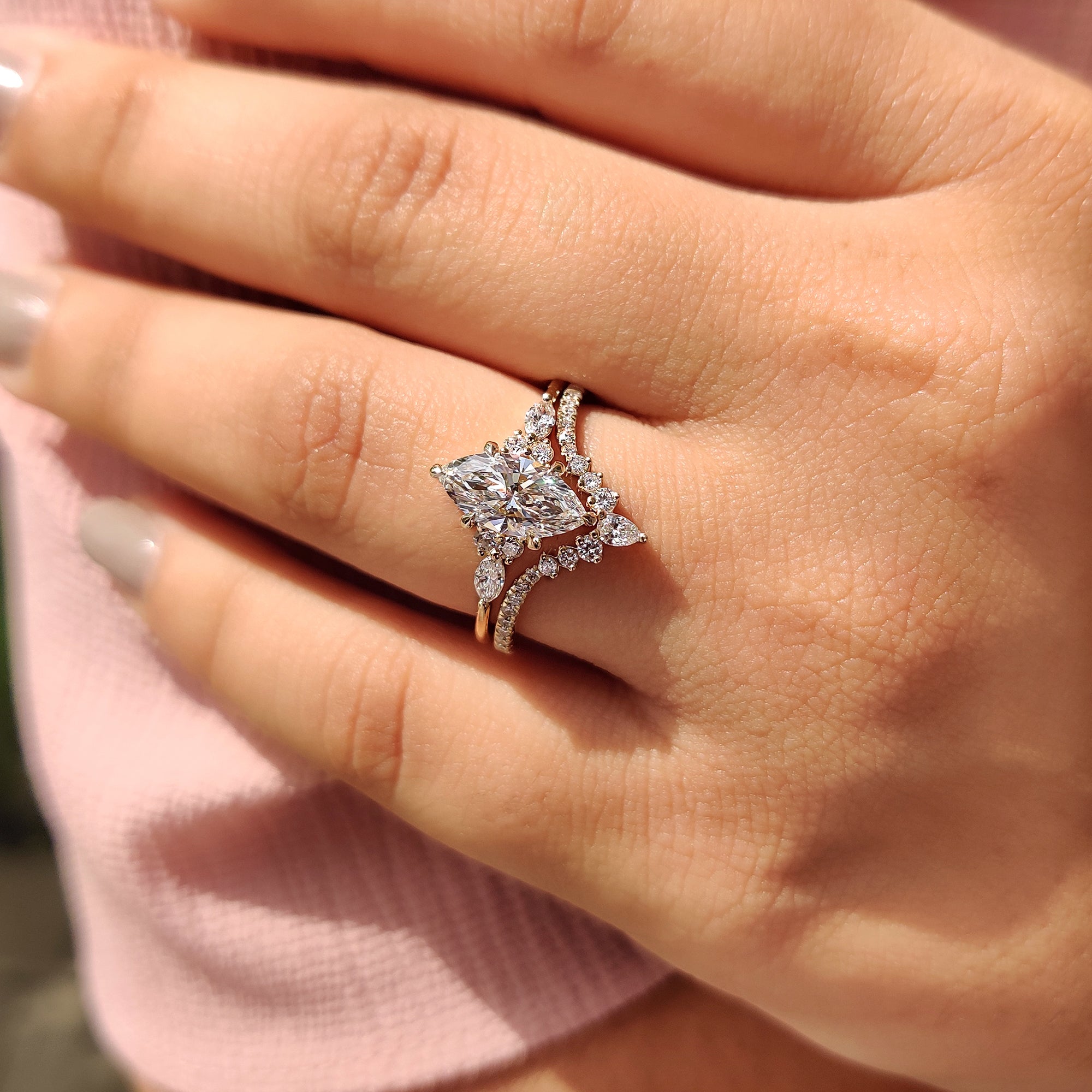 Six claw prong marquise ring in yellow gold bridal set.