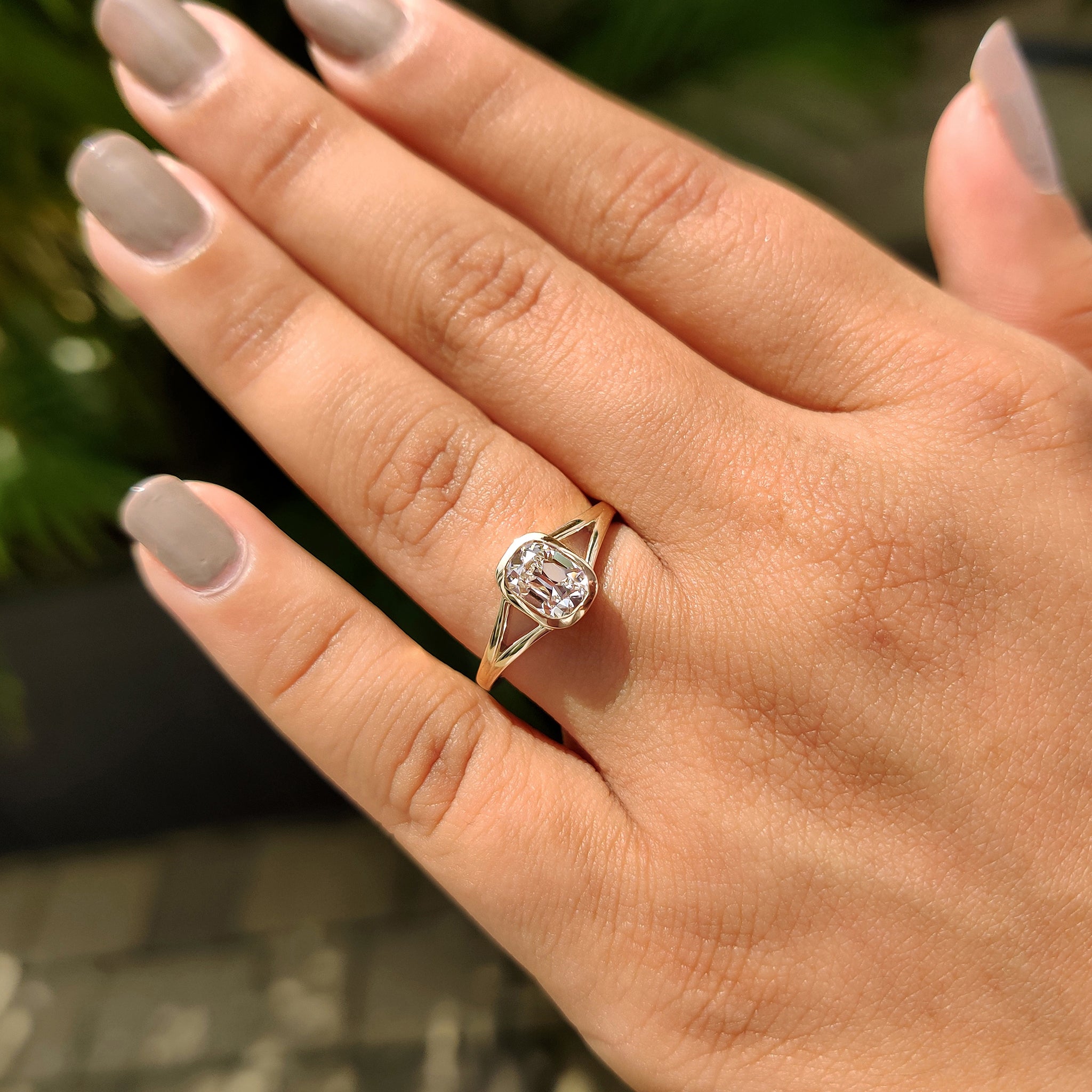 Solitaire engagement ring featuring old European cut lab grown diamond.