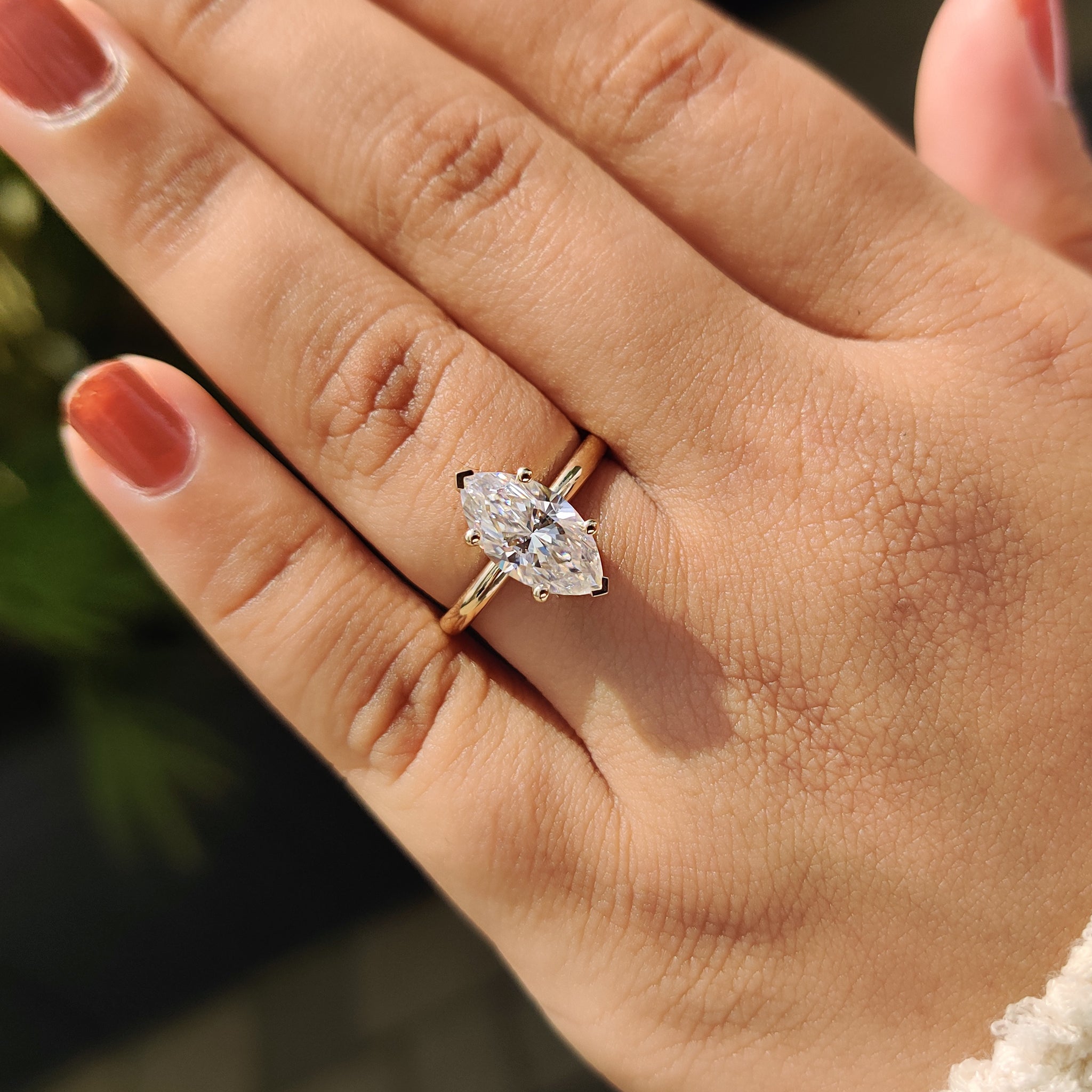 Hidden halo engagement ring with yellow gold engagement ring.