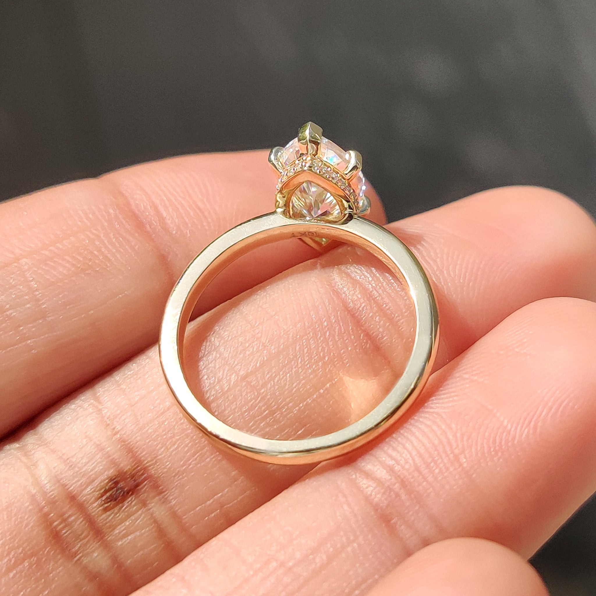 Marquise solitaire ring in hidden halo engagement ring.
