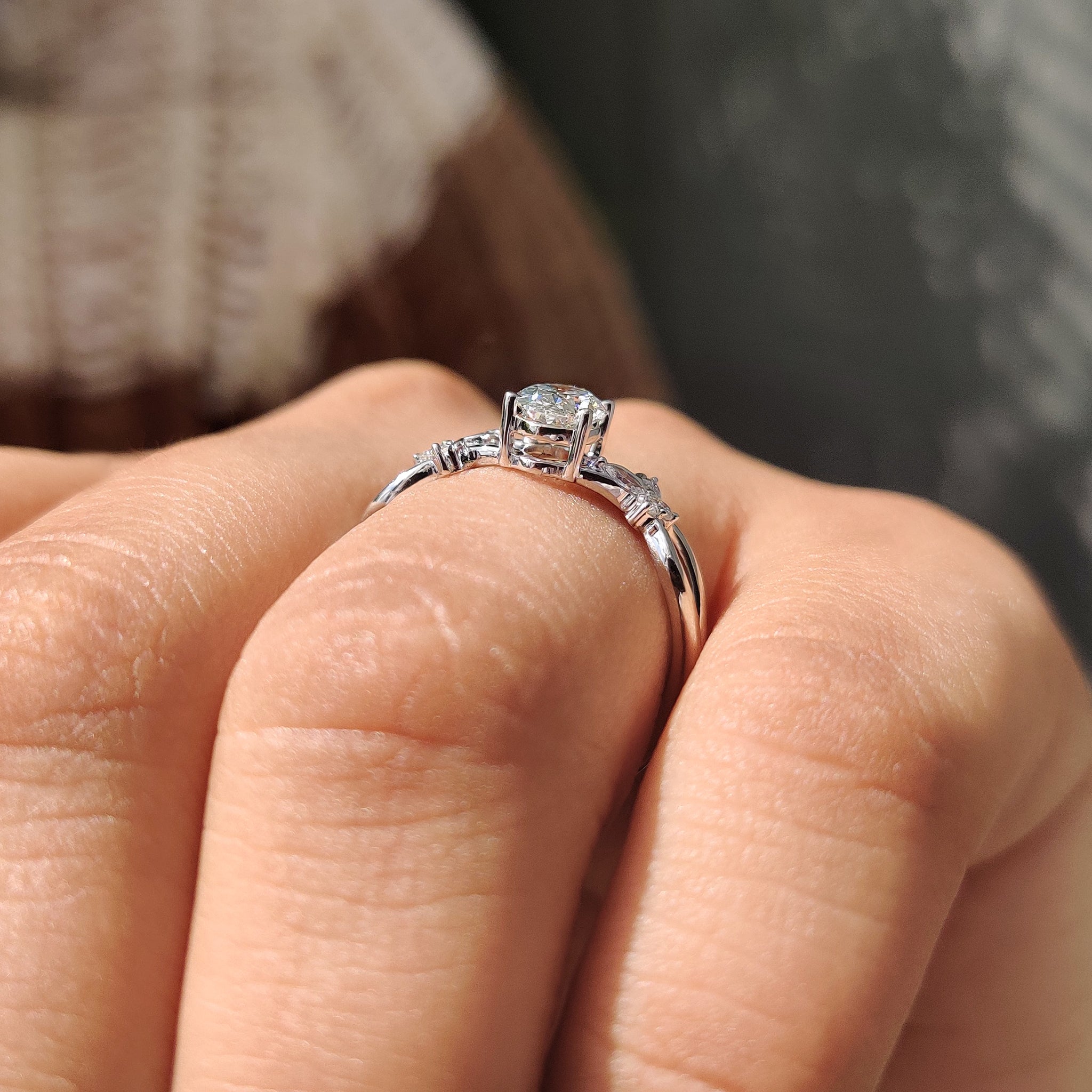 4 prong setting with white gold engagement ring.