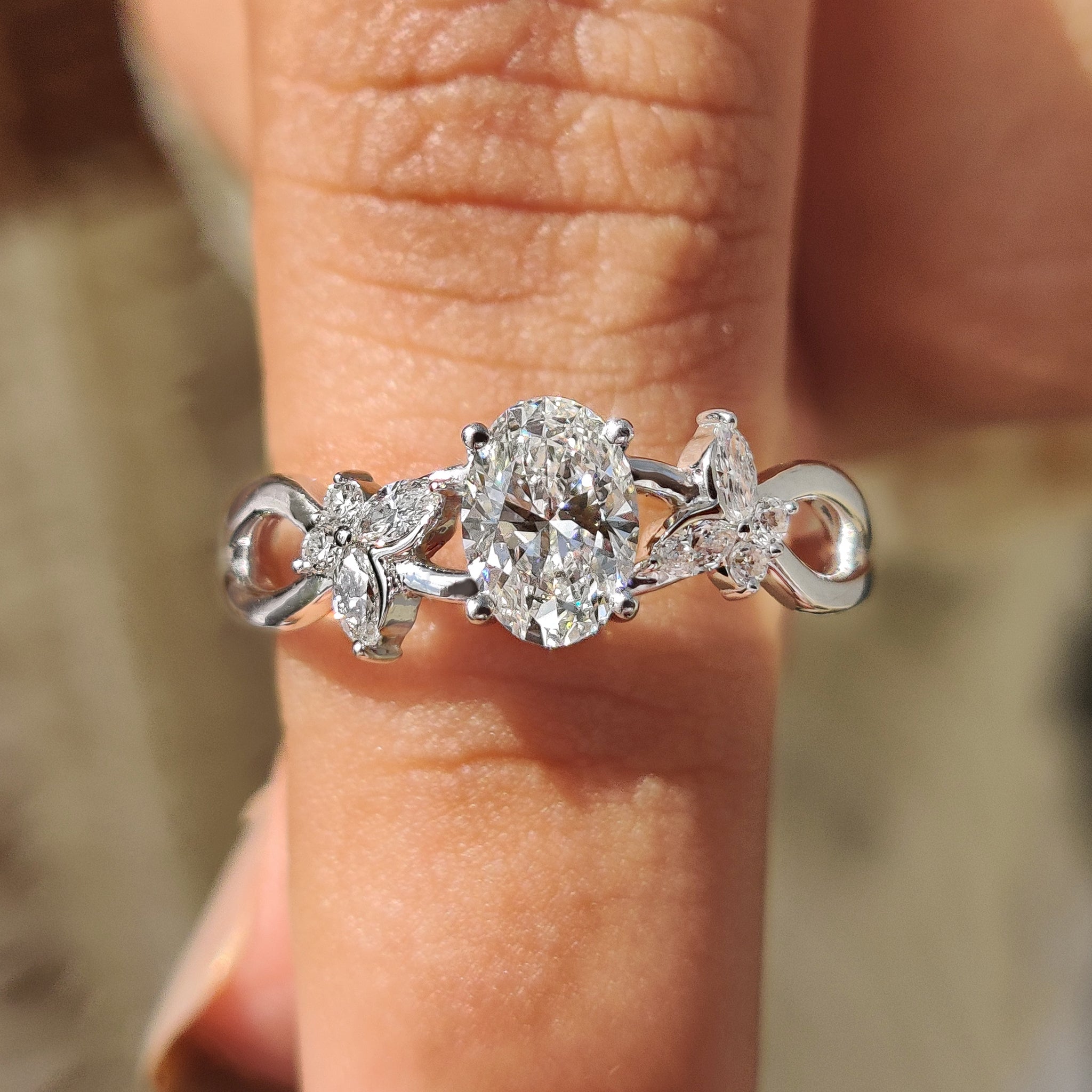 Marquise and round side stone with 4 prong setting.