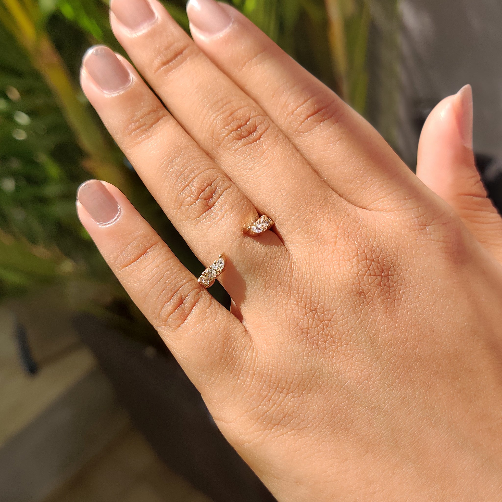 Carat Diamonds Yellow gold open wedding band with elegant diamond layout