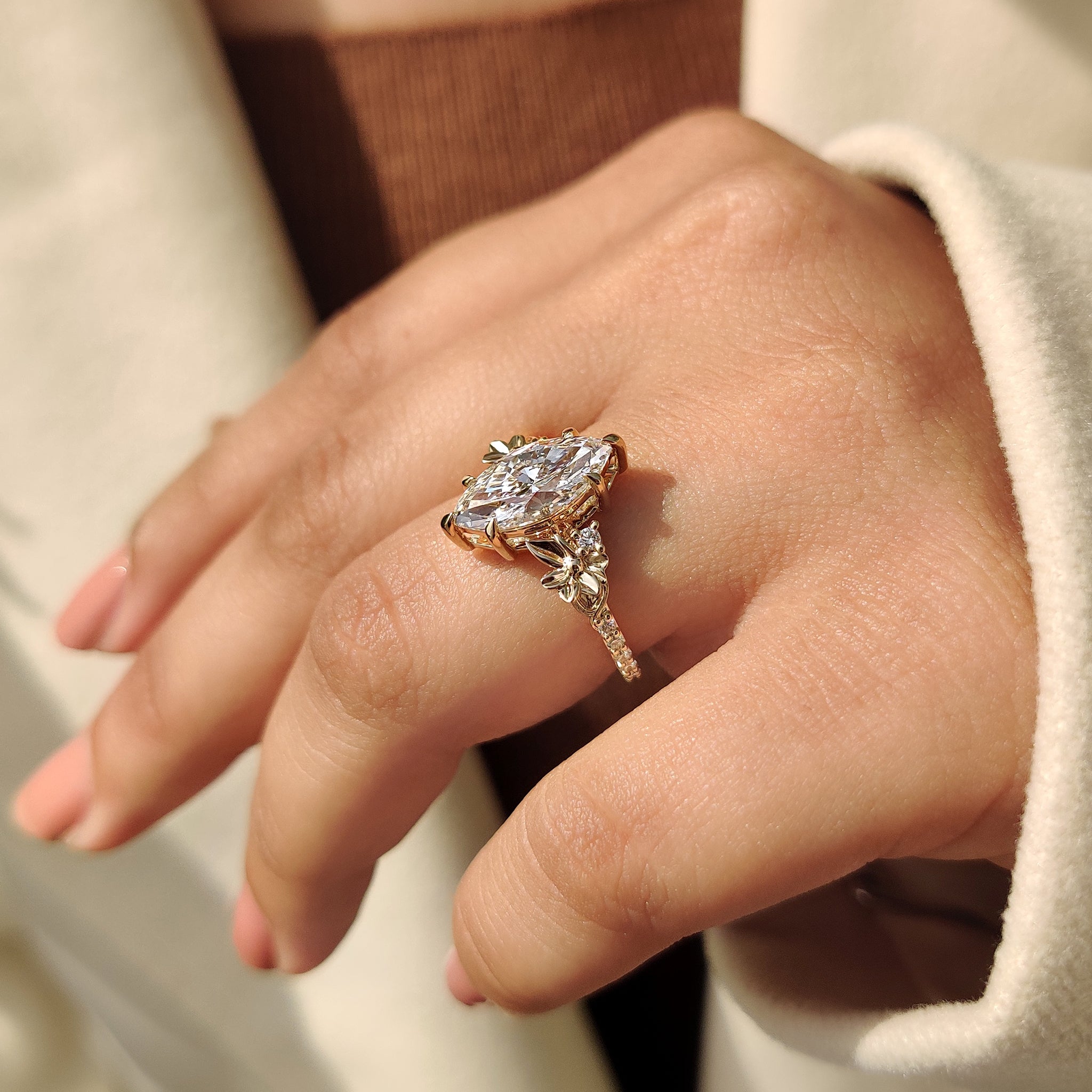 Marquise ring with round pave band.