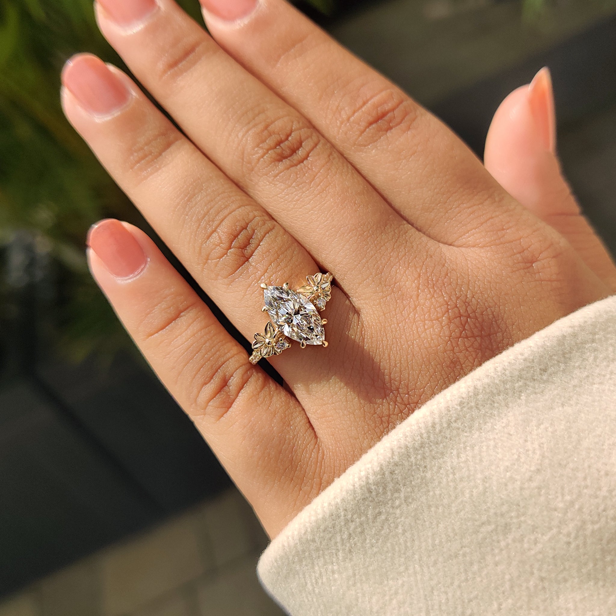 Marquise cut diamond with floral design.