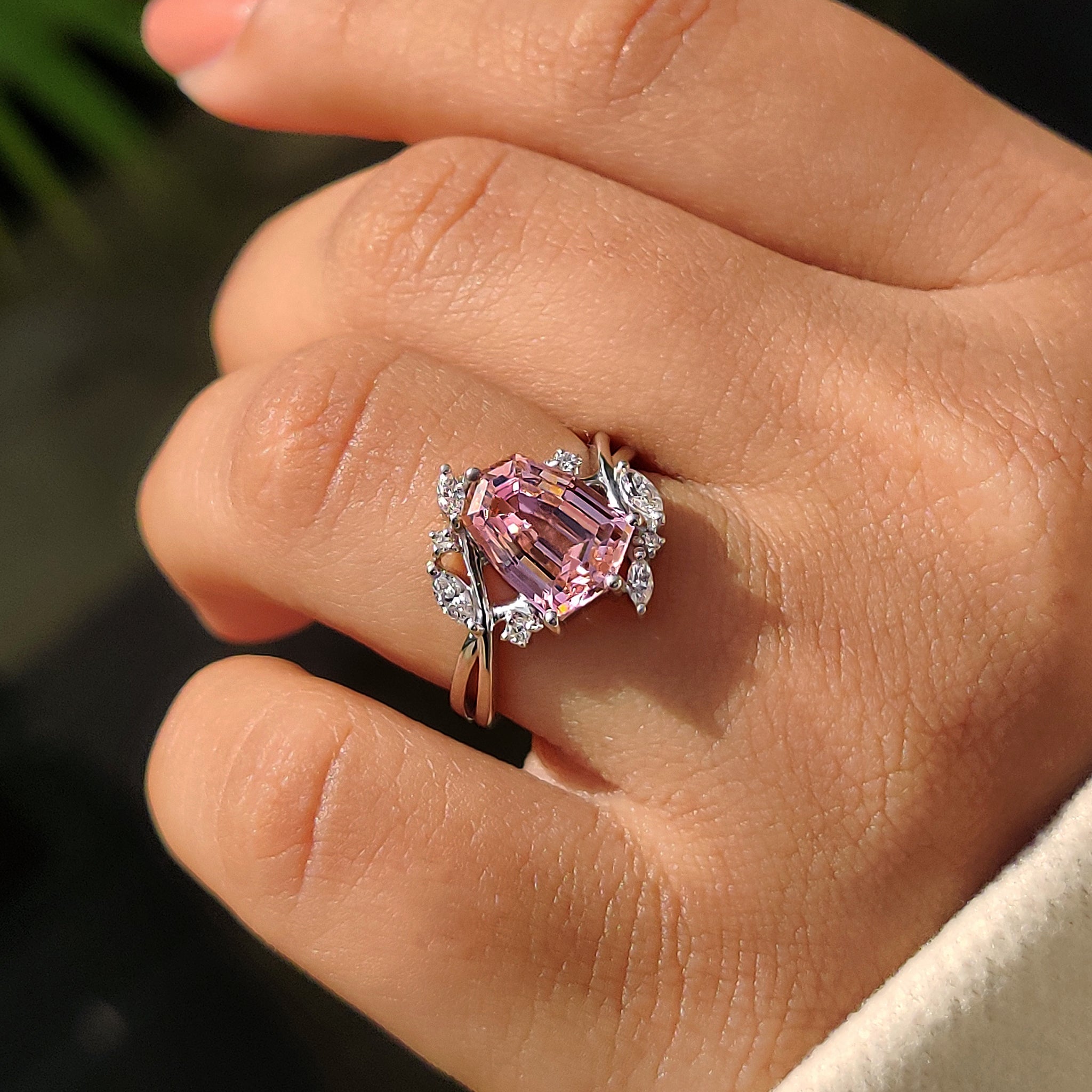 Carat diamonds engagement ring in pink gemstone setting.