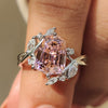 Bypass engagement ring with pink gemstone design.