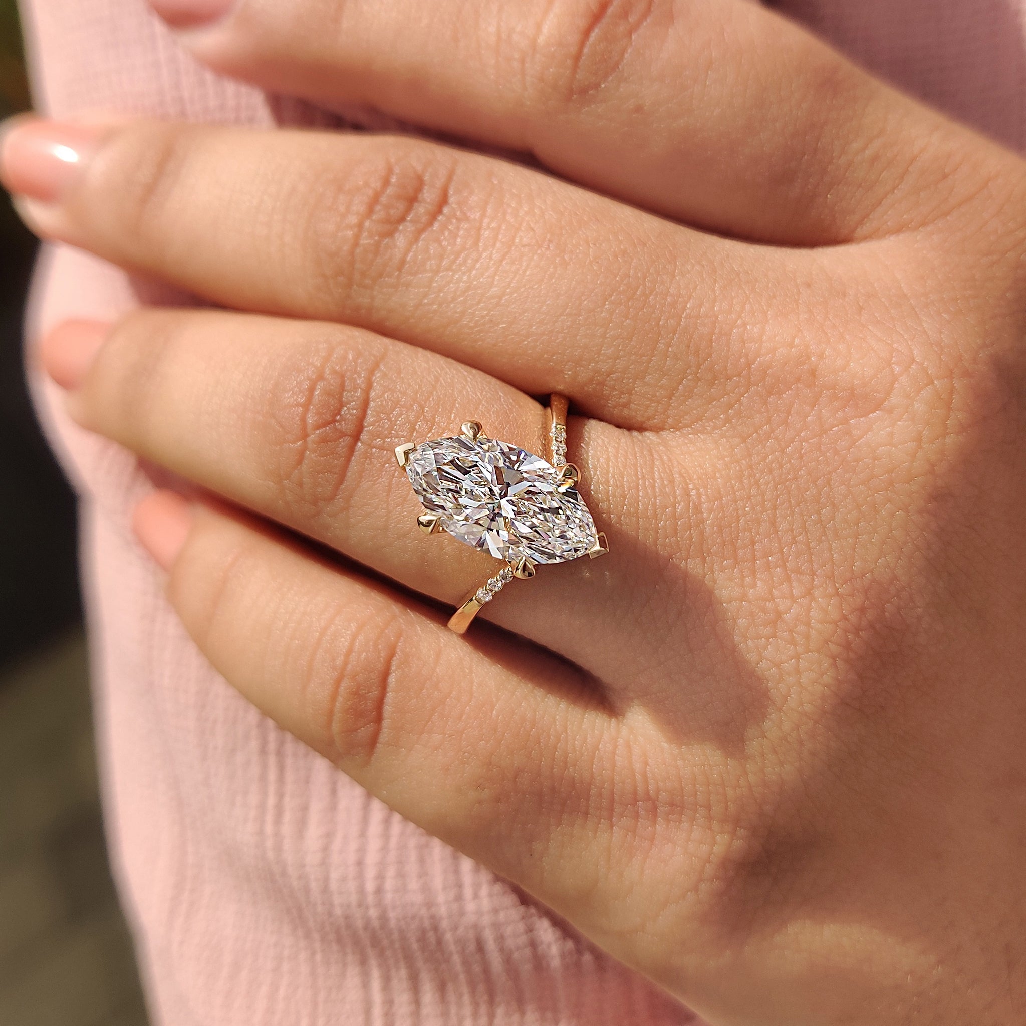 Basket setting marquise engagement ring
