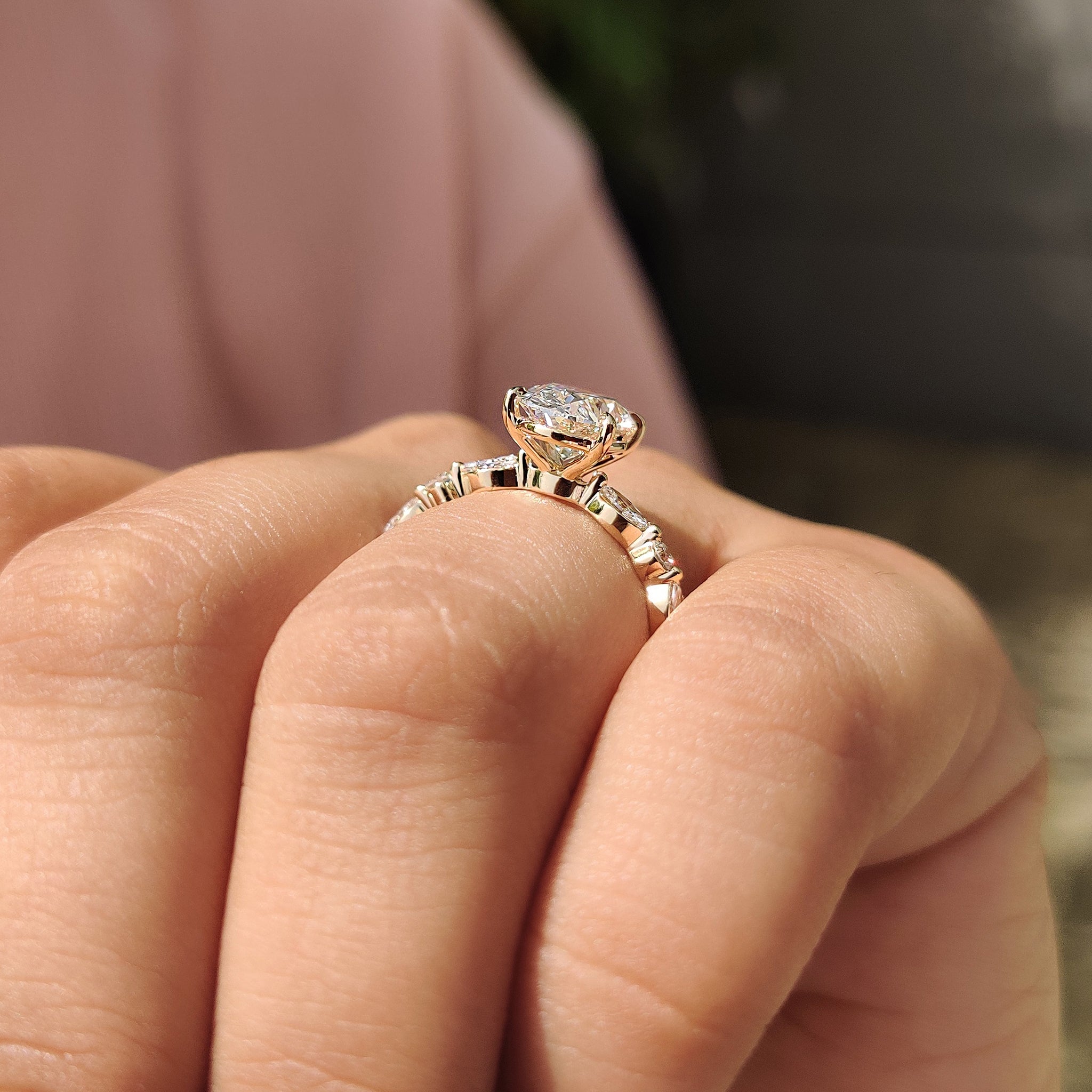 Four claw prong oval diamond engagement ring