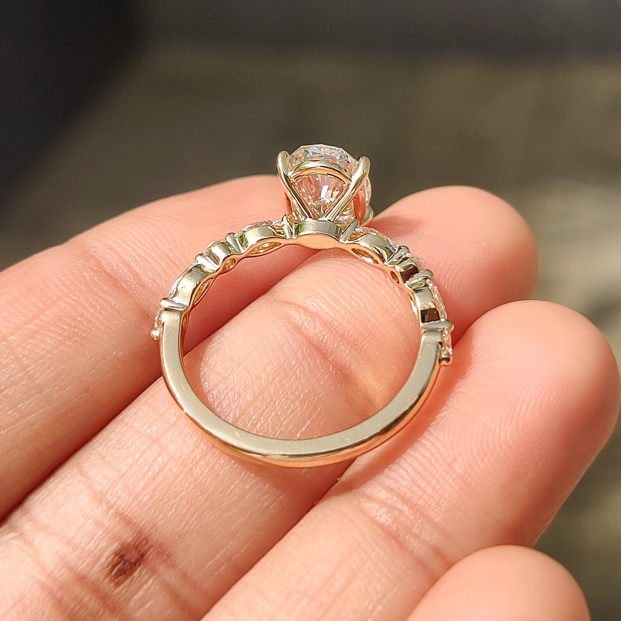 Oval engagement ring with pave band