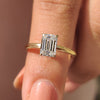 Emerald cut solitaire engagement ring in yellow gold