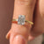 Emerald cut solitaire engagement ring in yellow gold