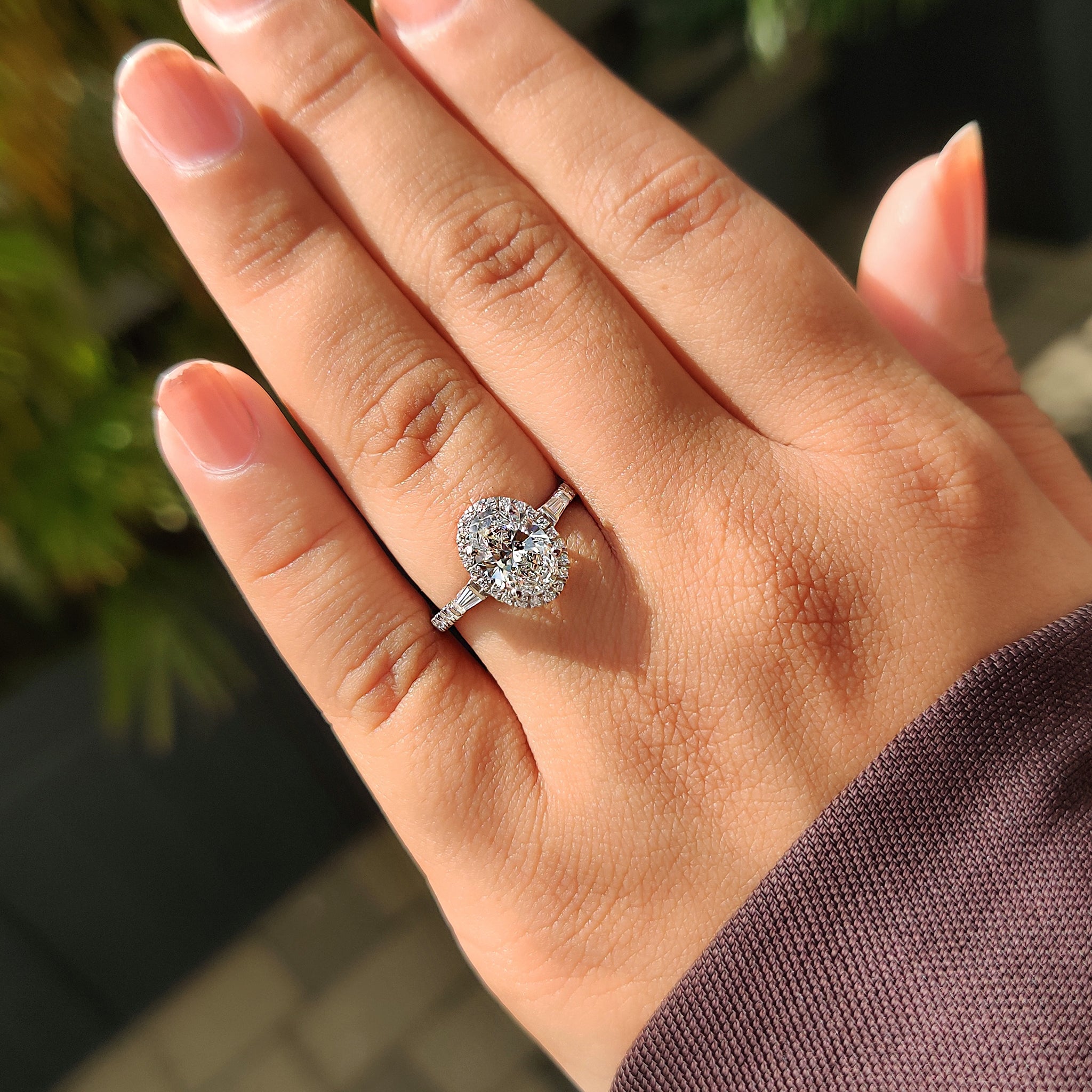 Tapered baguette side stone with 4 prong ring.